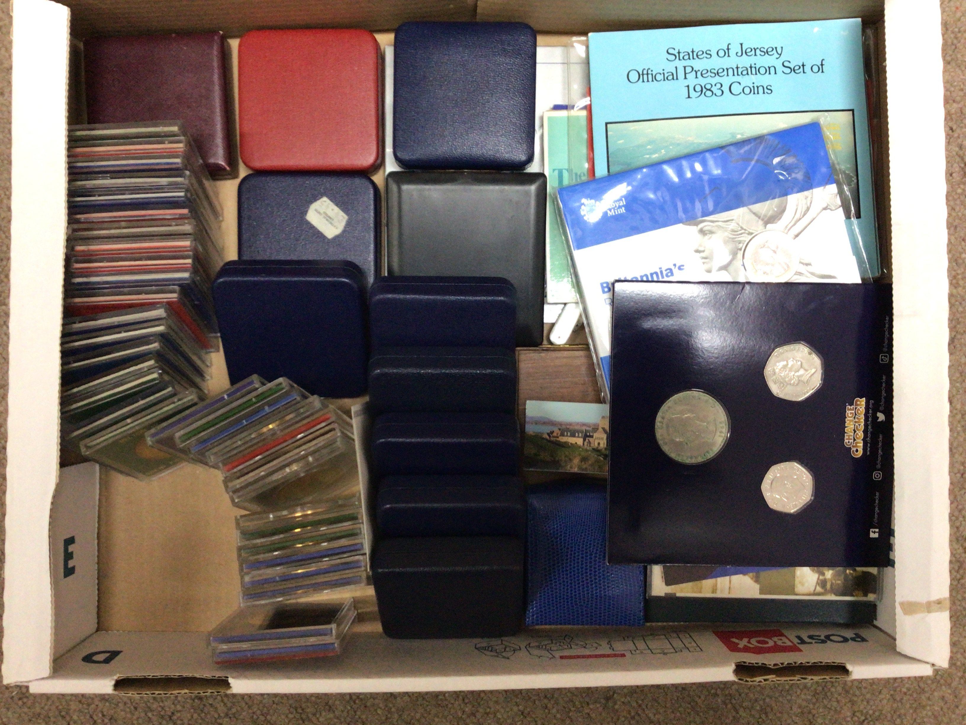 Two boxes of mixed coins including some silver and lots of USA. NO RESERVE