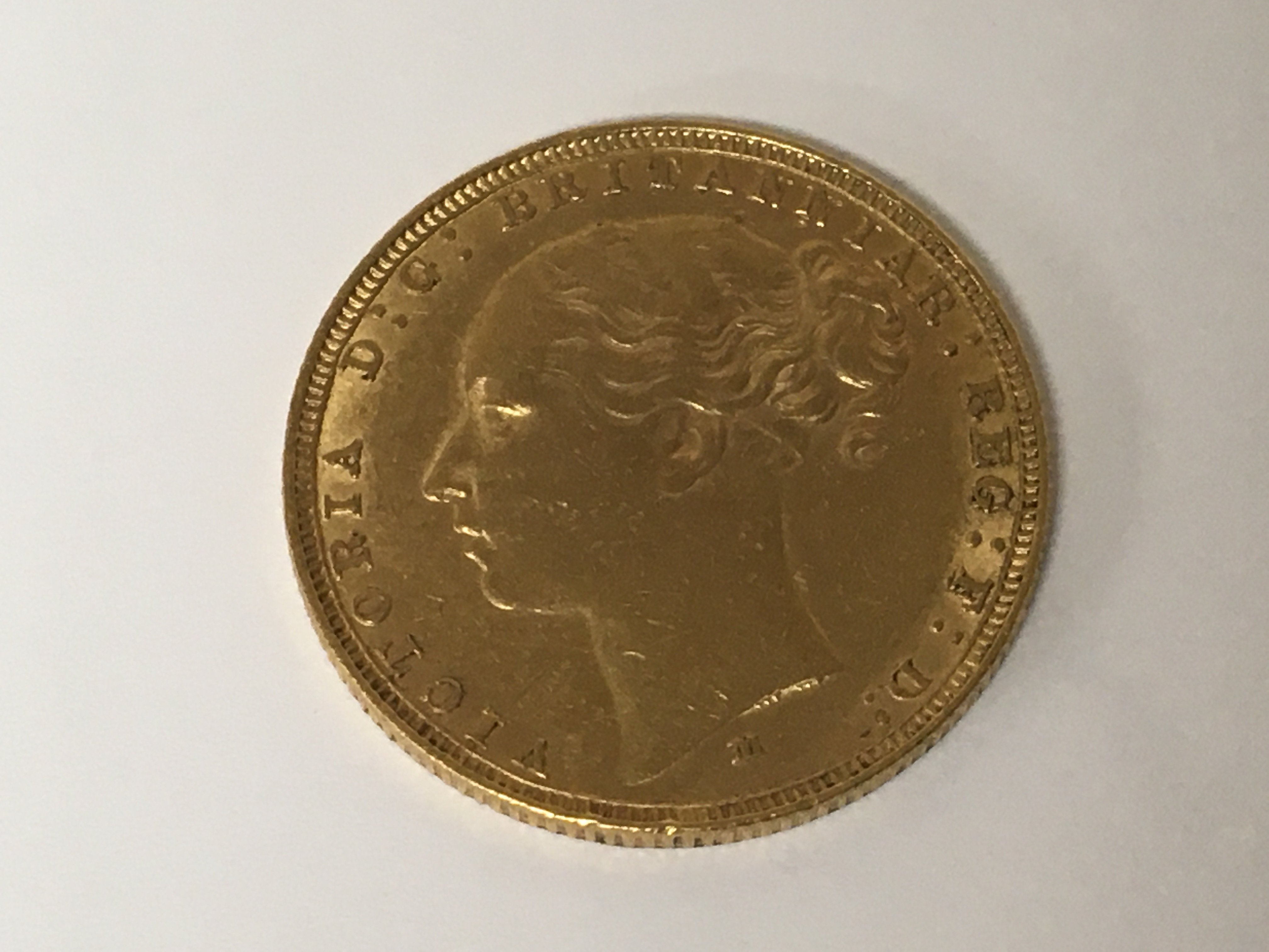 A Victorian gold full sovereign with Victorian younger side profile image 1881.