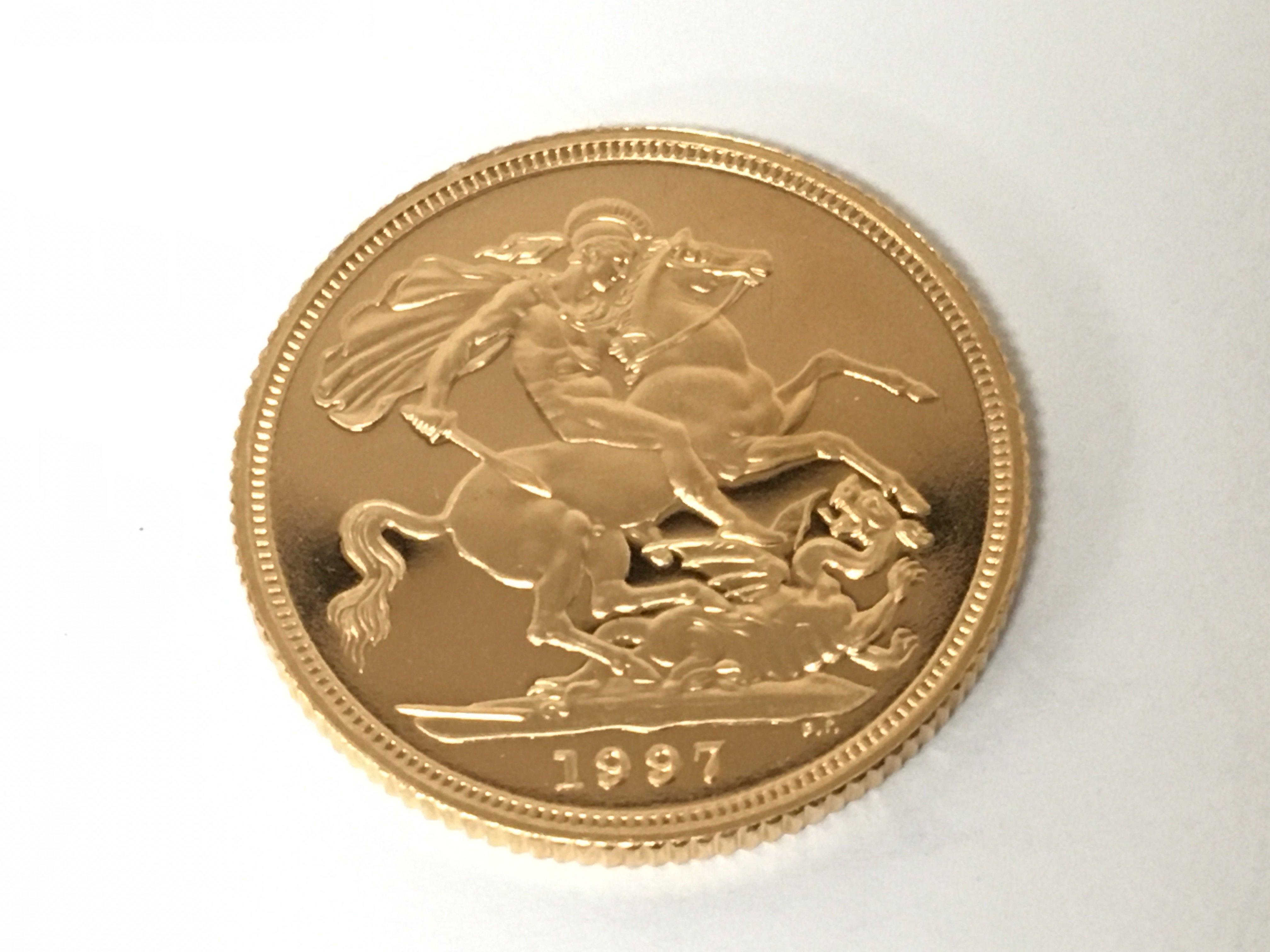 An Elizabeth II gold sovereign dated 1997.