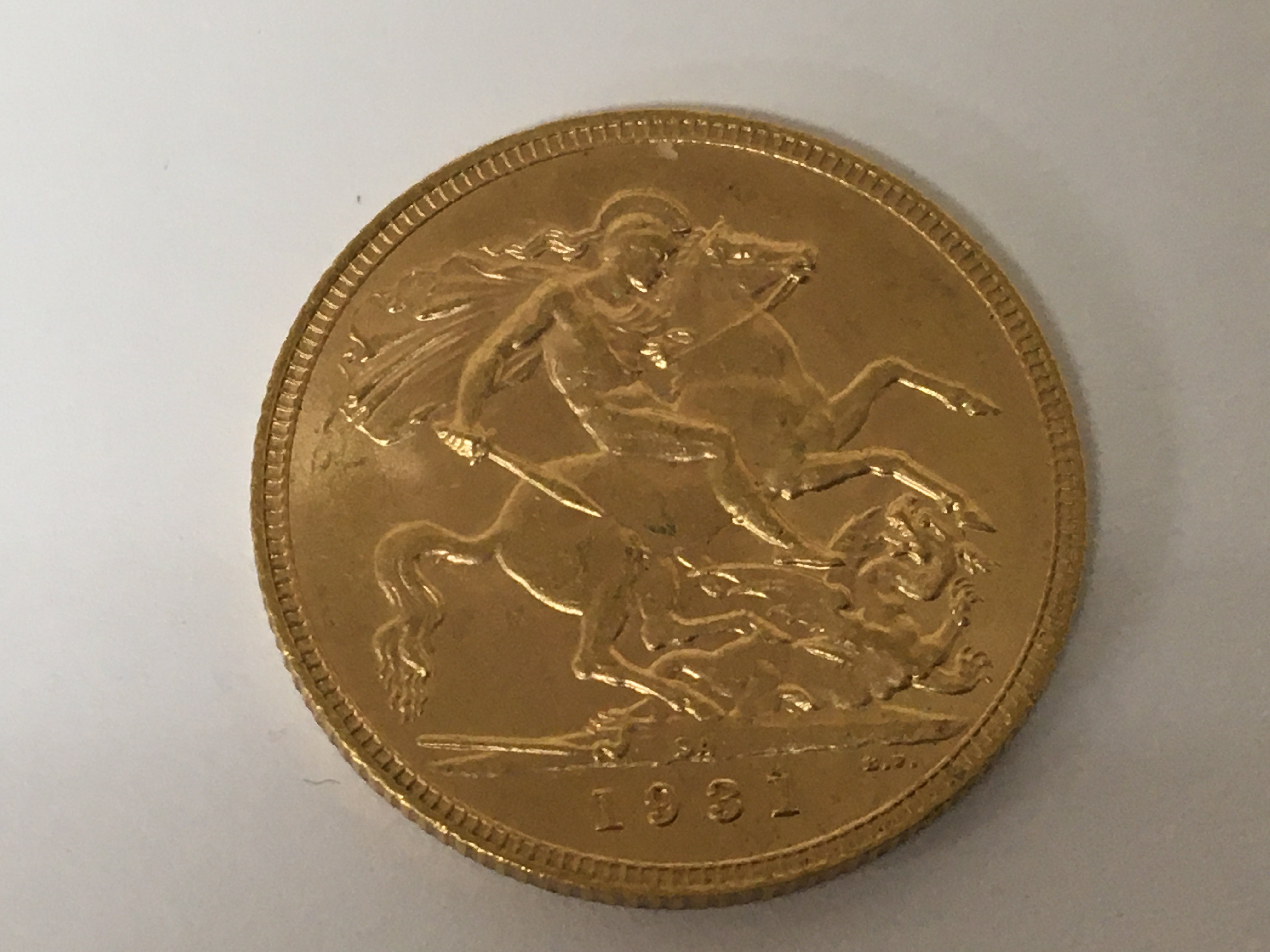 A George V 1931 gold sovereign.