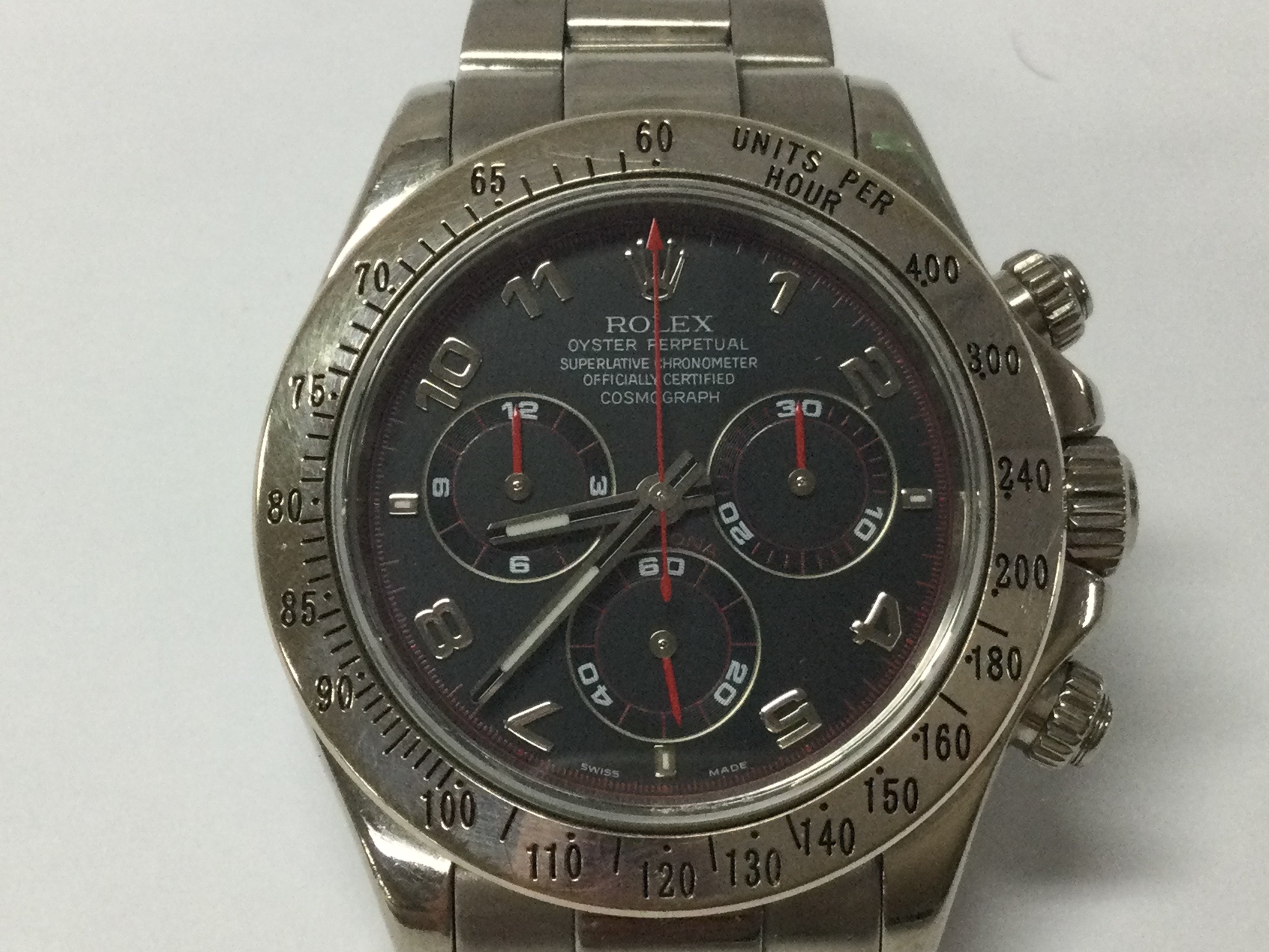 Rolex Daytona 18ct white gold case and strap. 40mm case. Racing dial with red sub dial hands . F serial number which is circa 2004. Watch running. No box or papers.