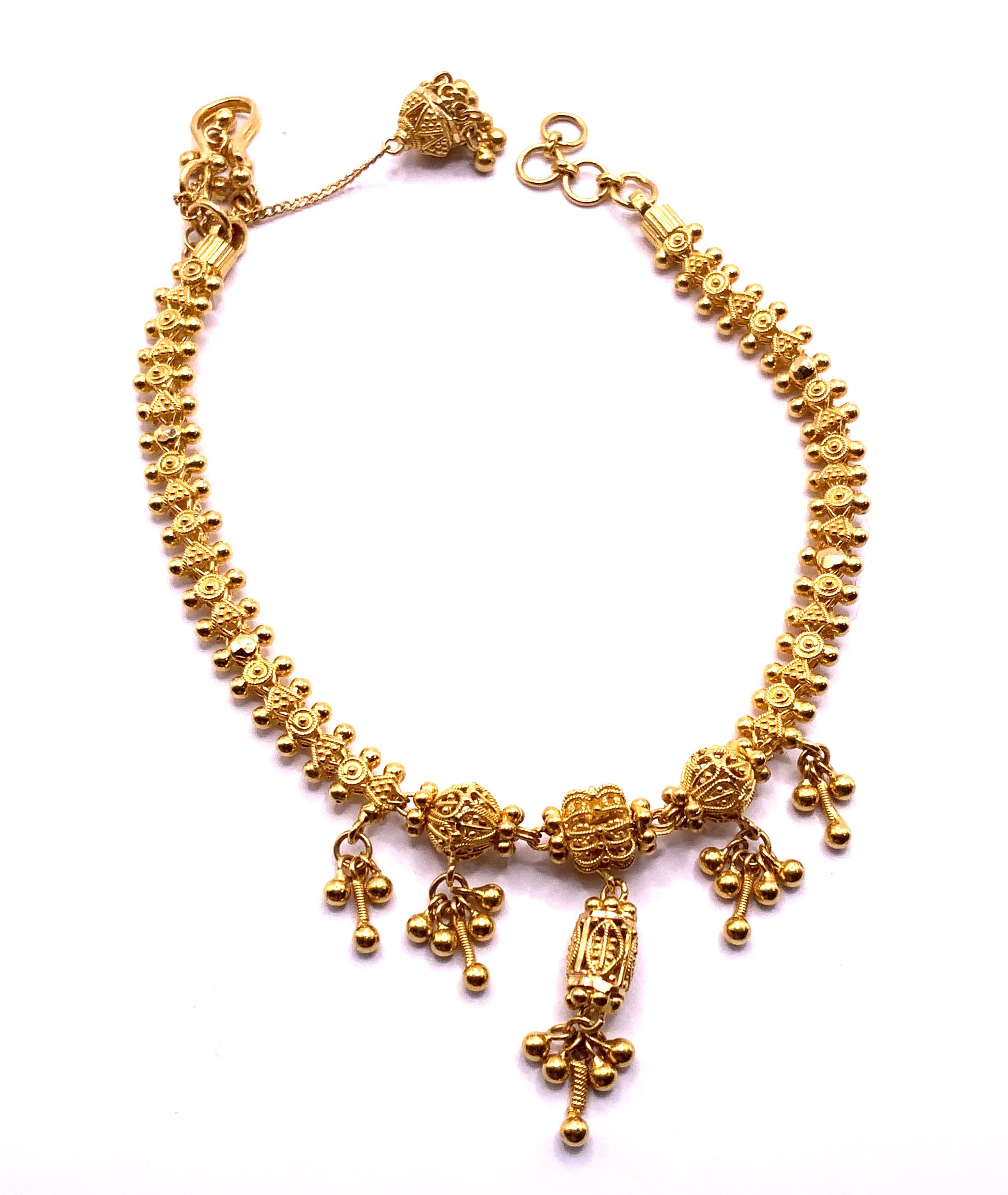 A 22ct gold Mughal design bracelet. Total weight 13.3gs (A)