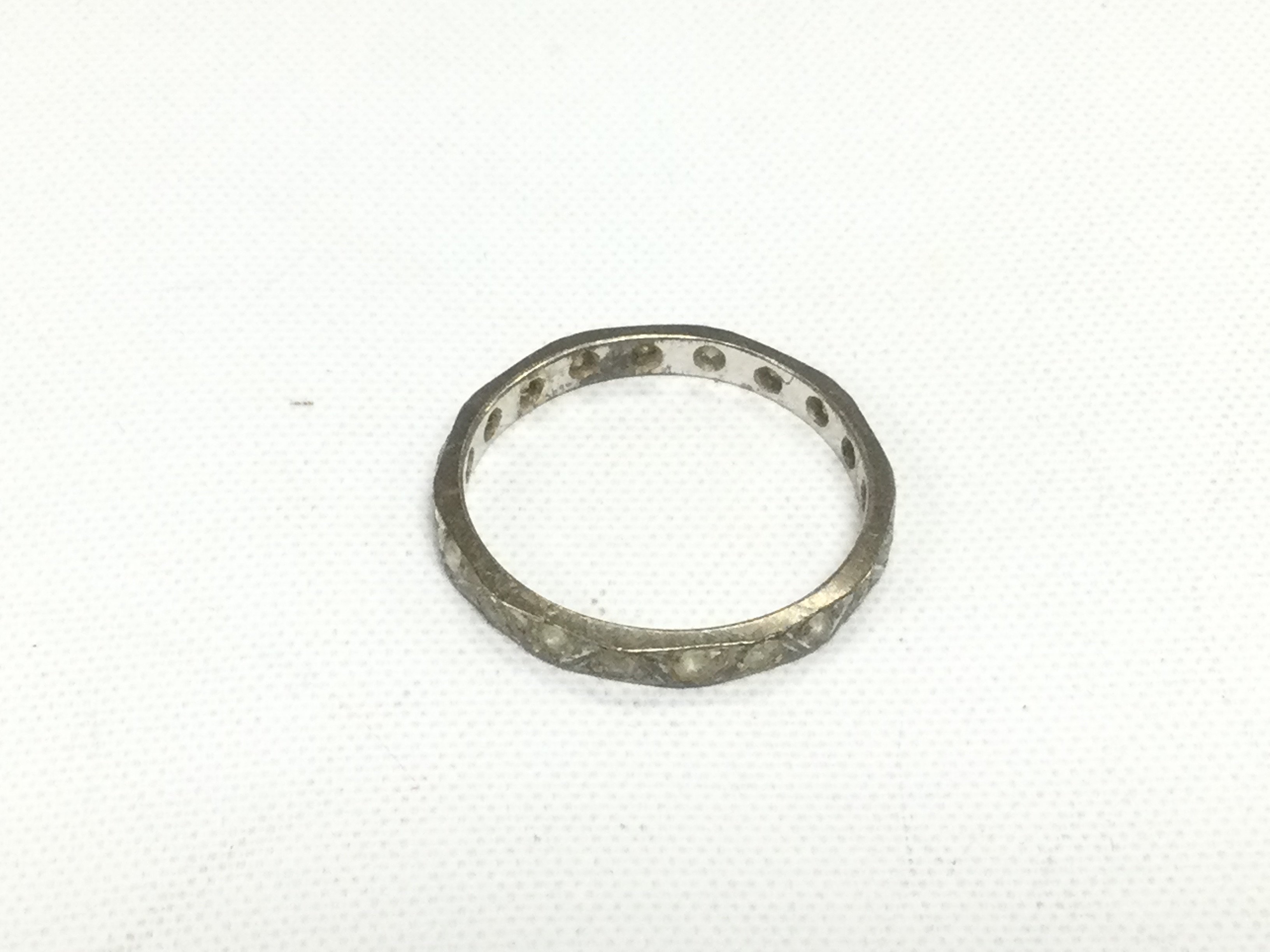 An unmarked eternity ring, approx size P. Shipping category A.