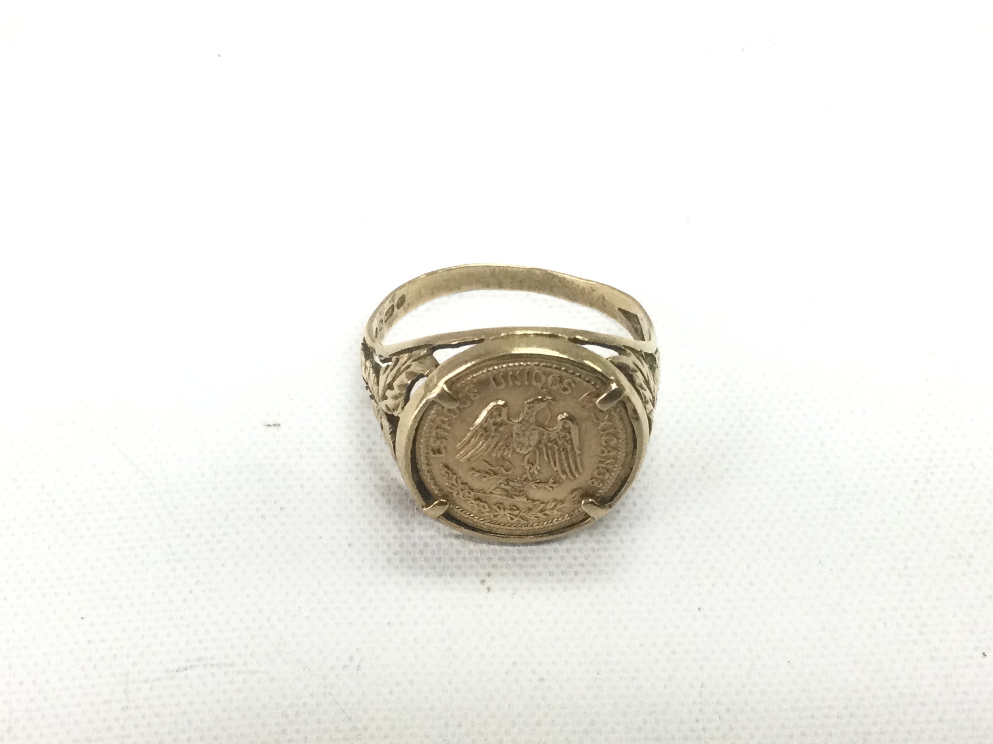 A gold coin ring, approx 3.3g. Shipping category A.