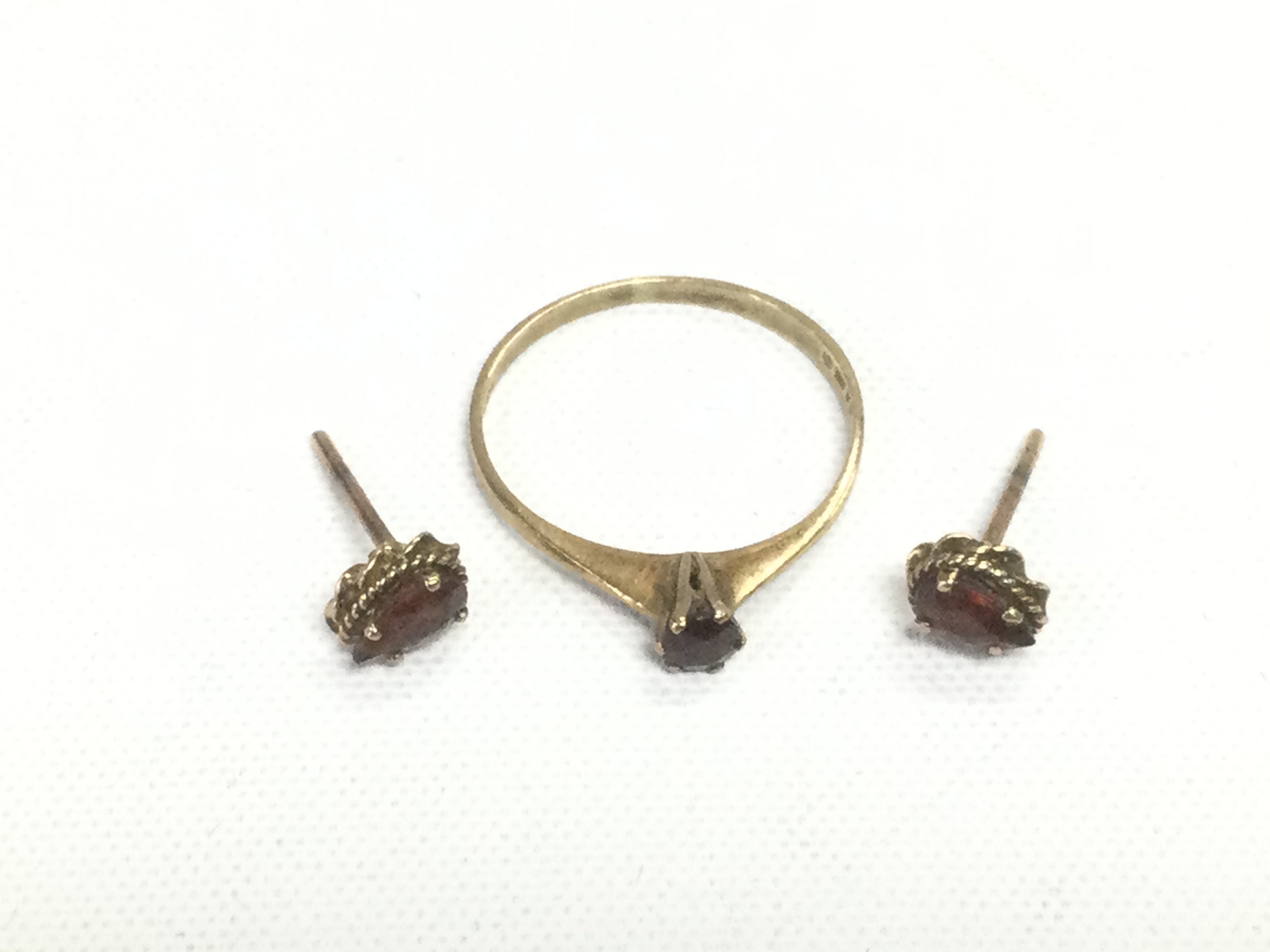 A 9ct gold ring and a pair of matching earrings, approx total weight 1.3g. Shipping category A.