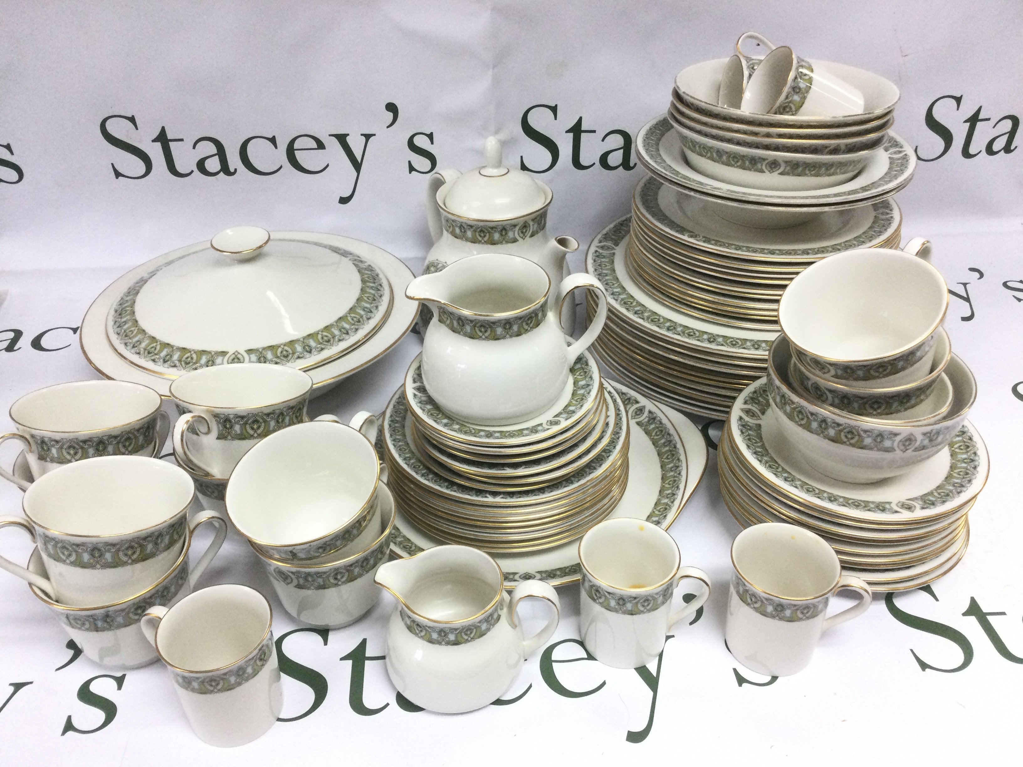 A Royal Doulton tea and dinner service in Celtic Jewel pattern. Shipping category D.