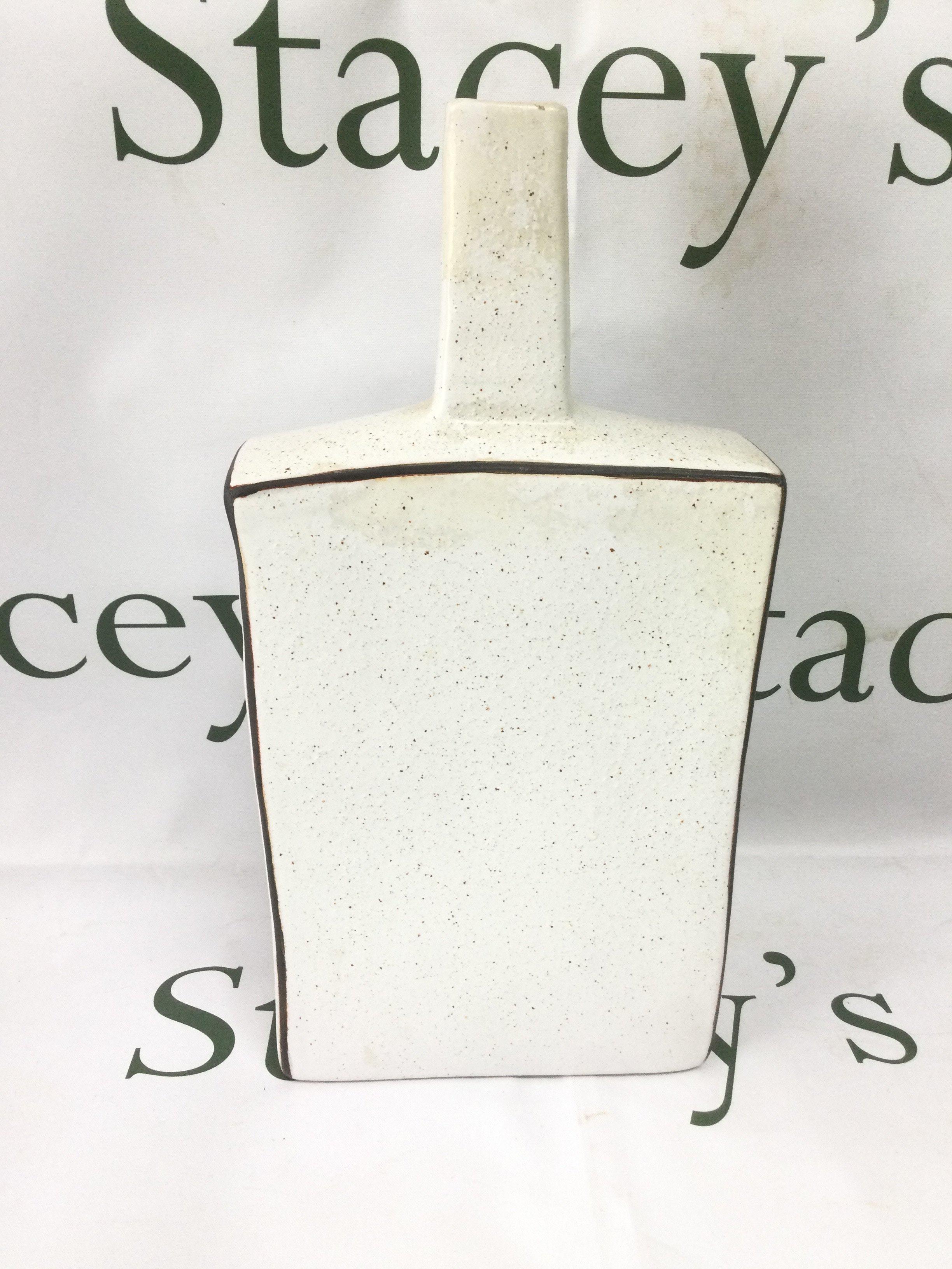 An unusual Troika vase of extended chimney shape in a subdued mottled finish, approx height 32.5cm. Shipping category D.