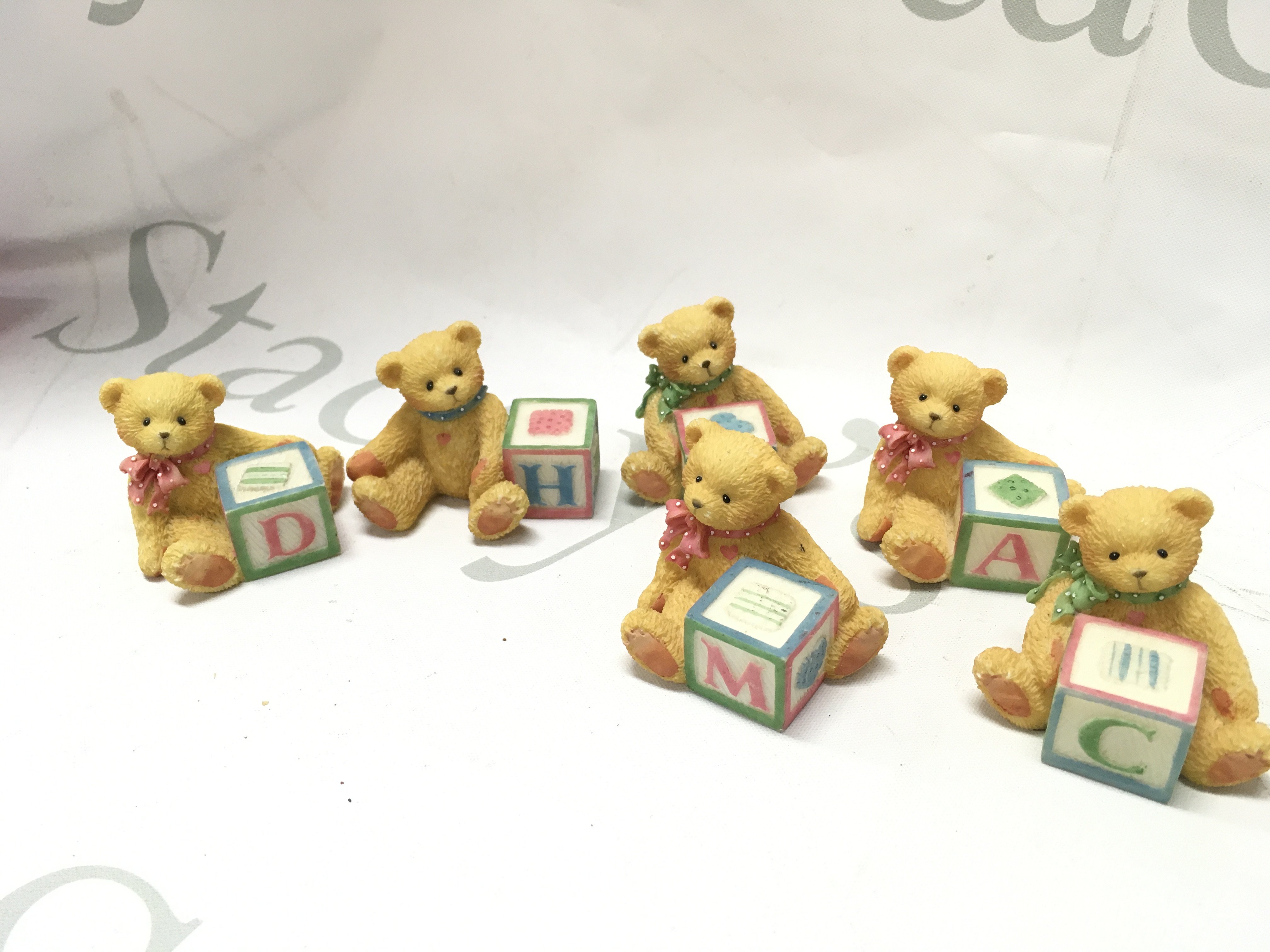 A collection of resin teddy figures including Cherished Teddies figures Ella, Benji, Violet etc. display box, Bentham pottery jug. This lot cannot be posted. NO RESERVE