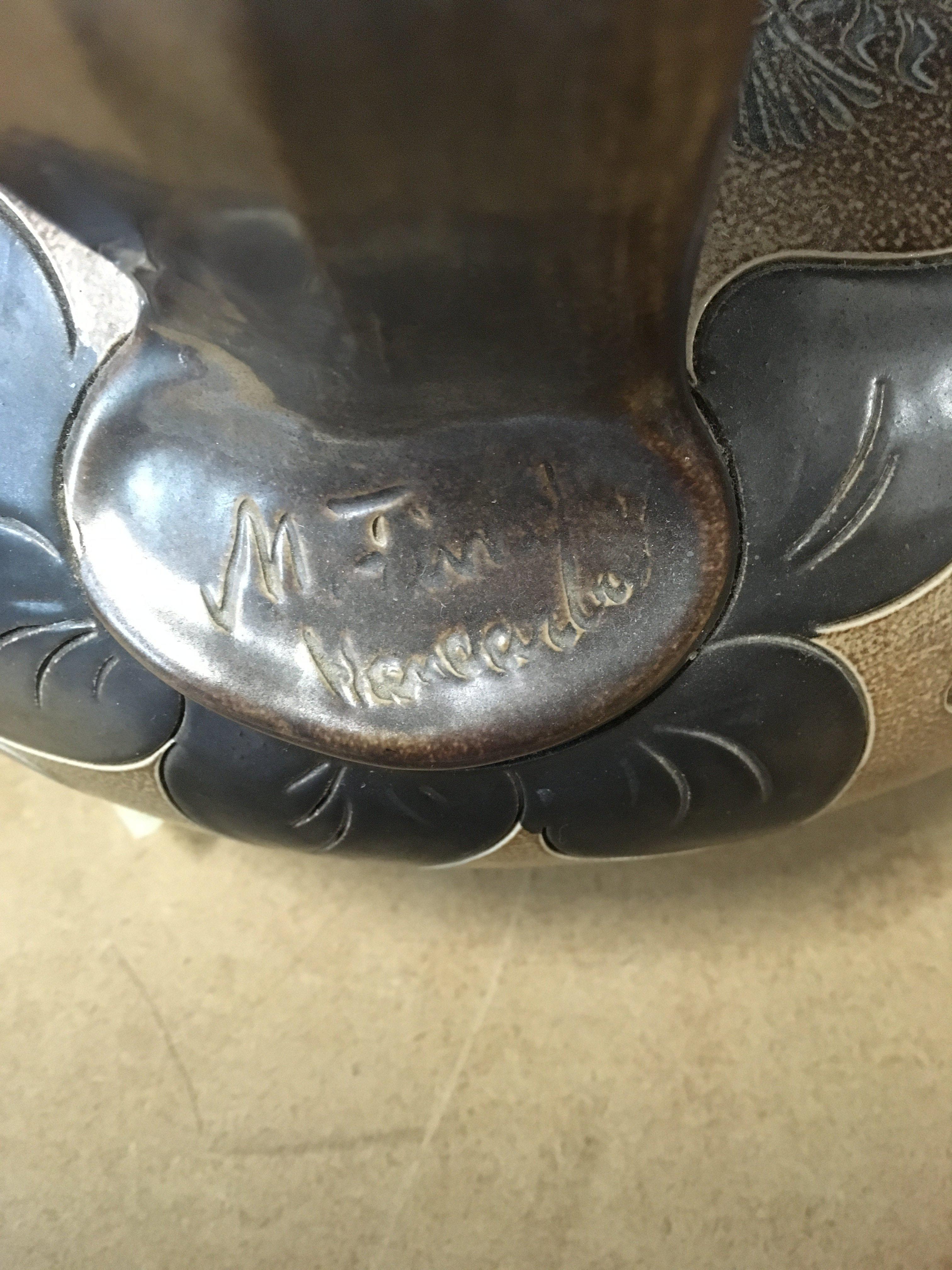 A large Doulton style stoneware jug decorated with flowers and foliage. NO RESERVE