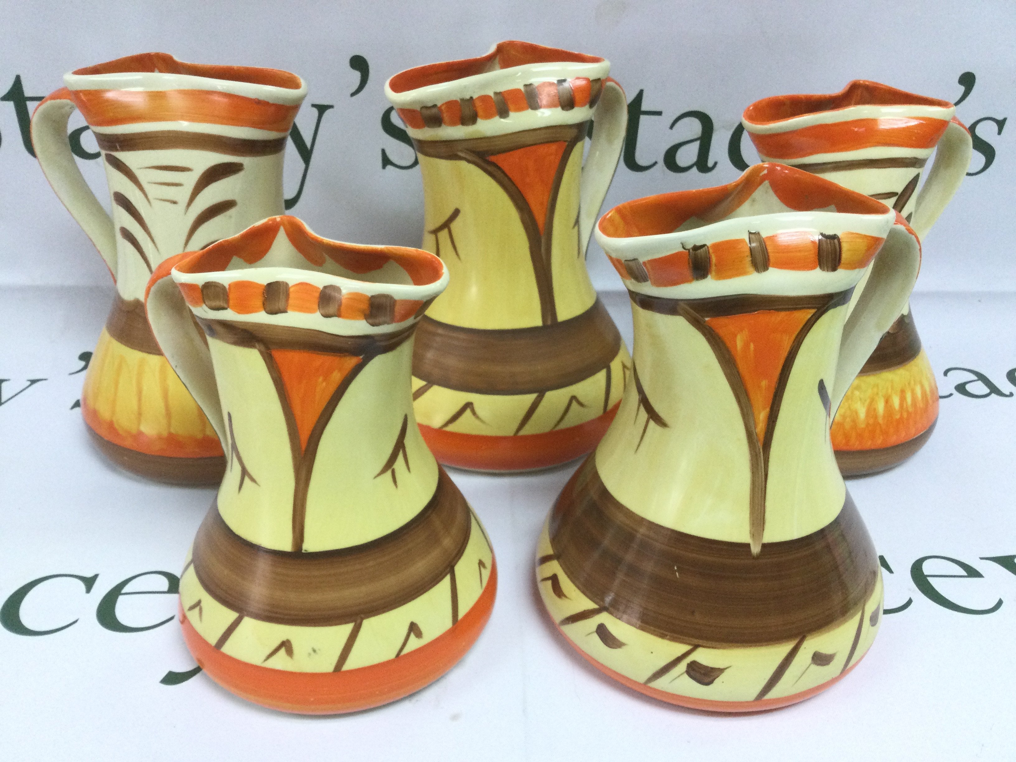 Ten Myott & Son pinched neck pottery jugs, tallest approx 20cm. Shipping category D. NO RESERVE