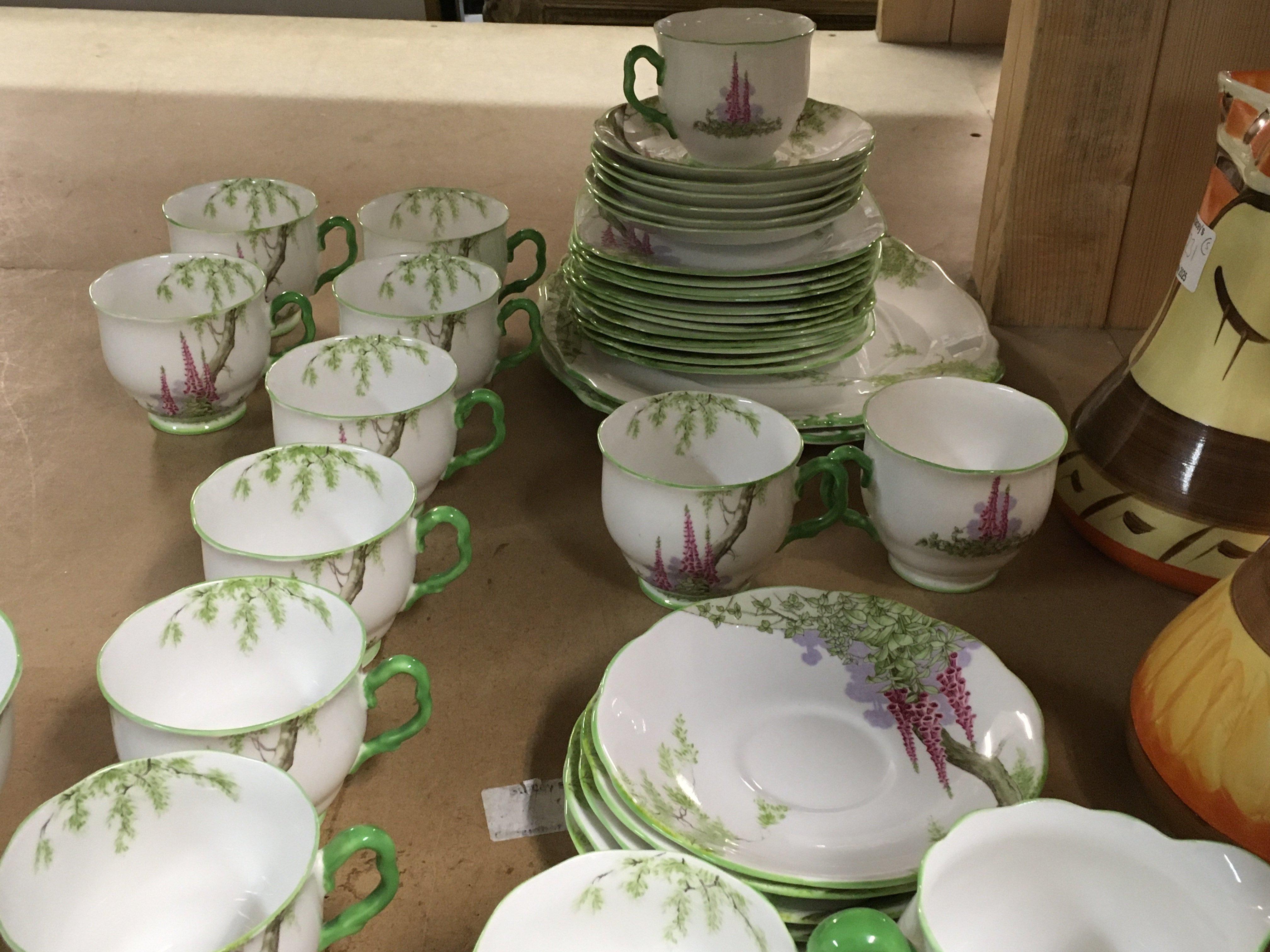 A Royal Albert foxglove tea set comprising twelve cups and saucers side plates dishes and milk jug .