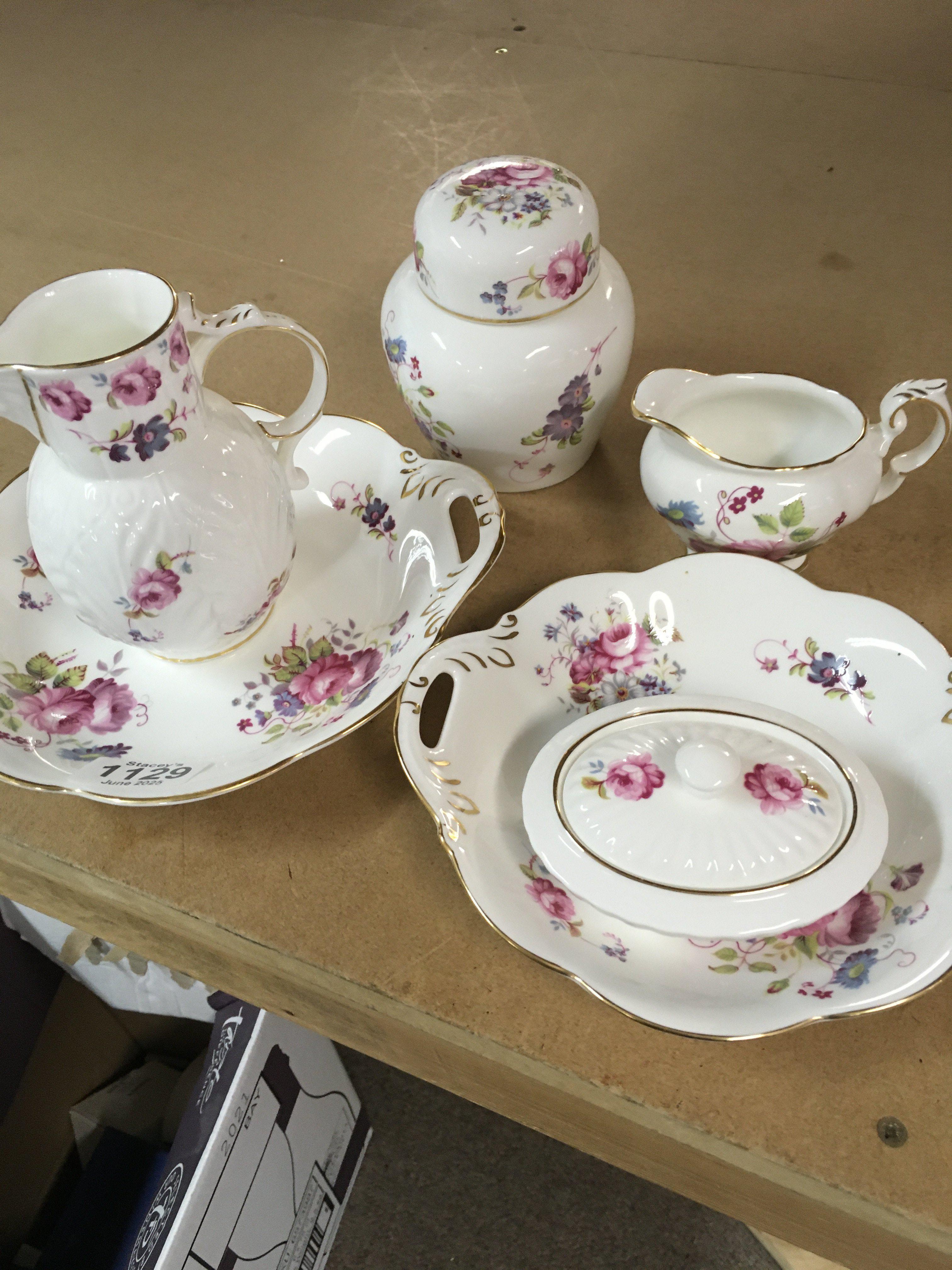A collection of Coalport decorated with flowers and foliage.including dishes And jugs .