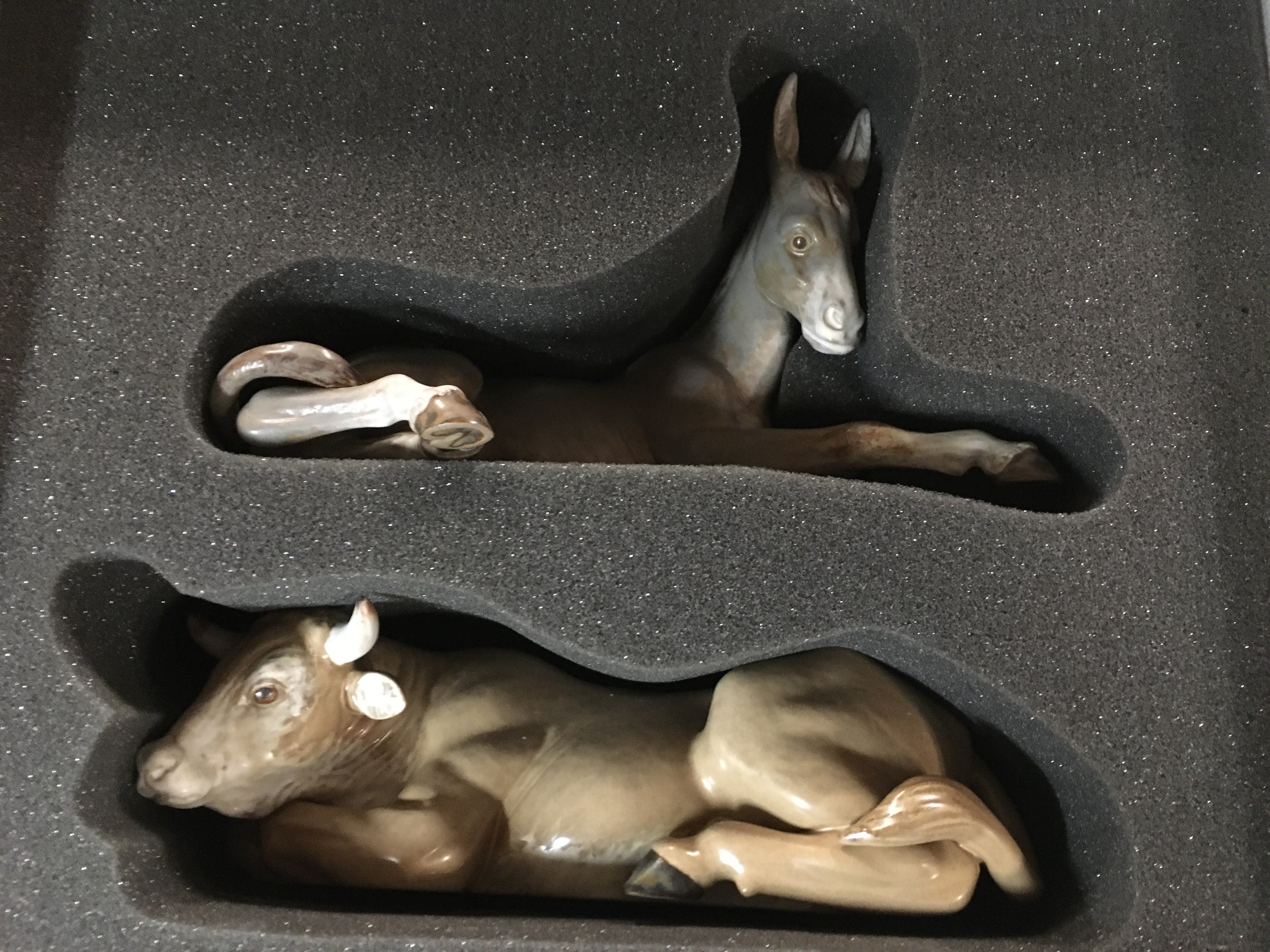 Lladro figures donkey and cow in original box .