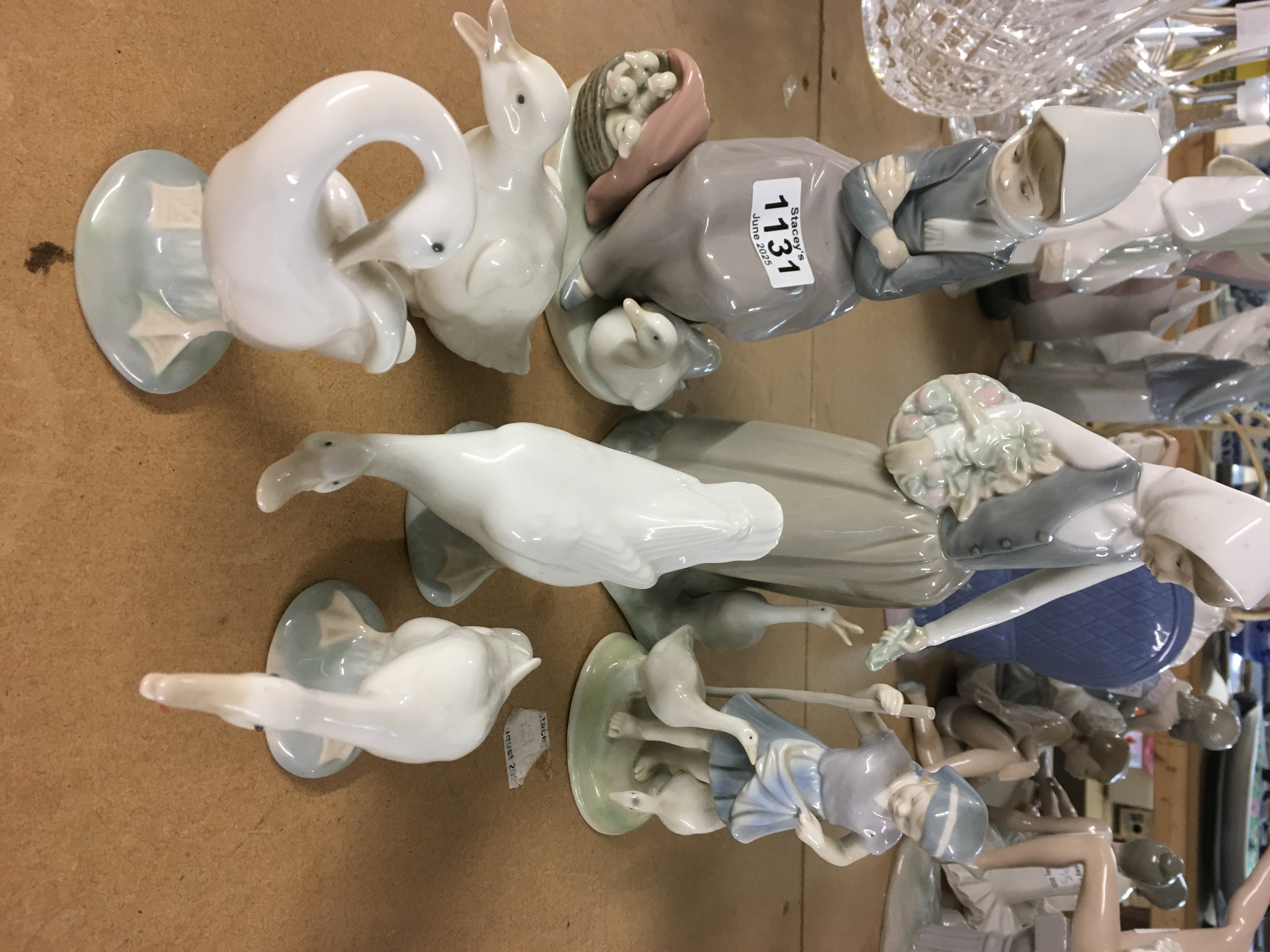 A collection of Lladro including figures with geese (7)