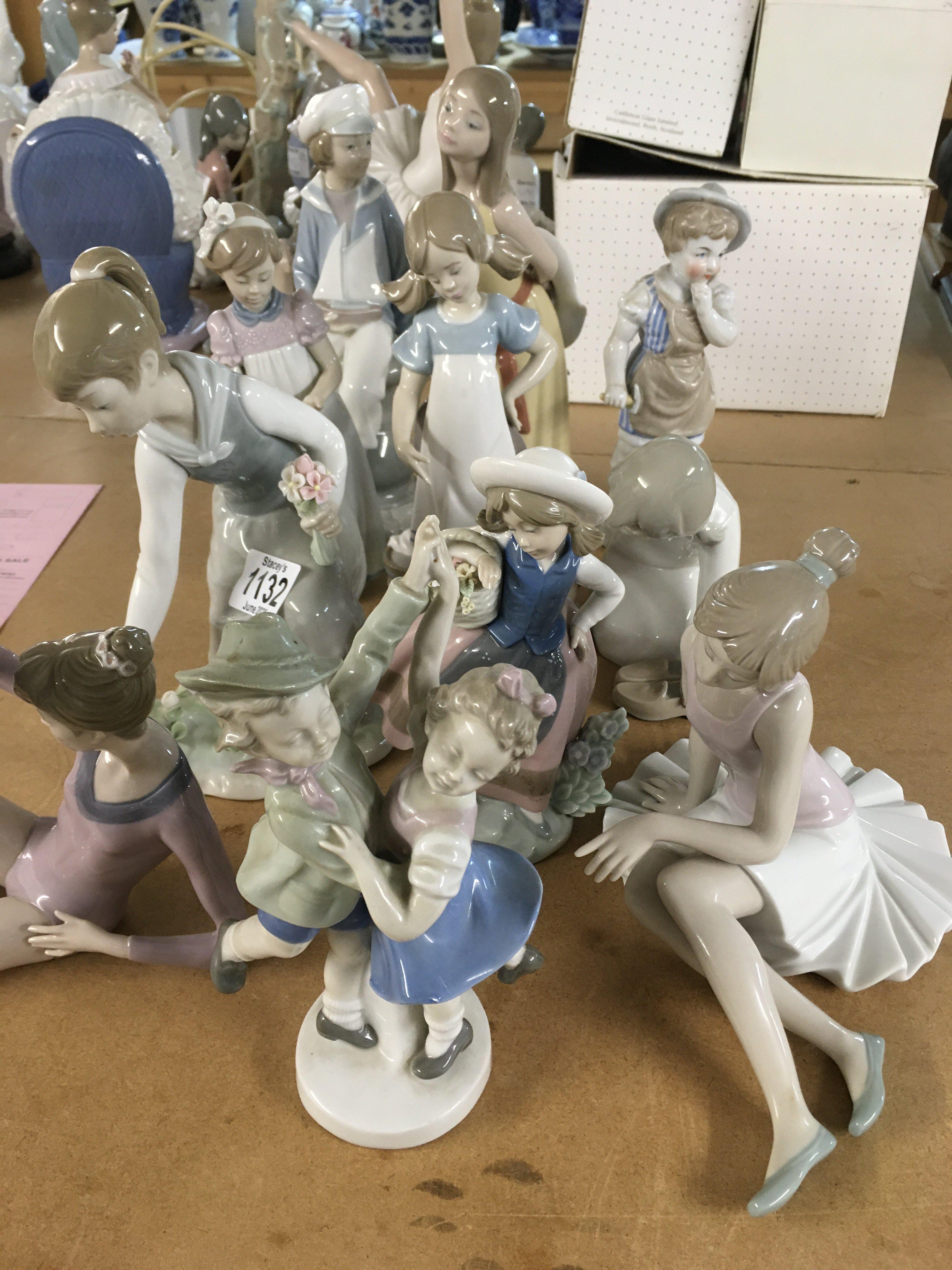 A collection of eleven figures including Lladro.