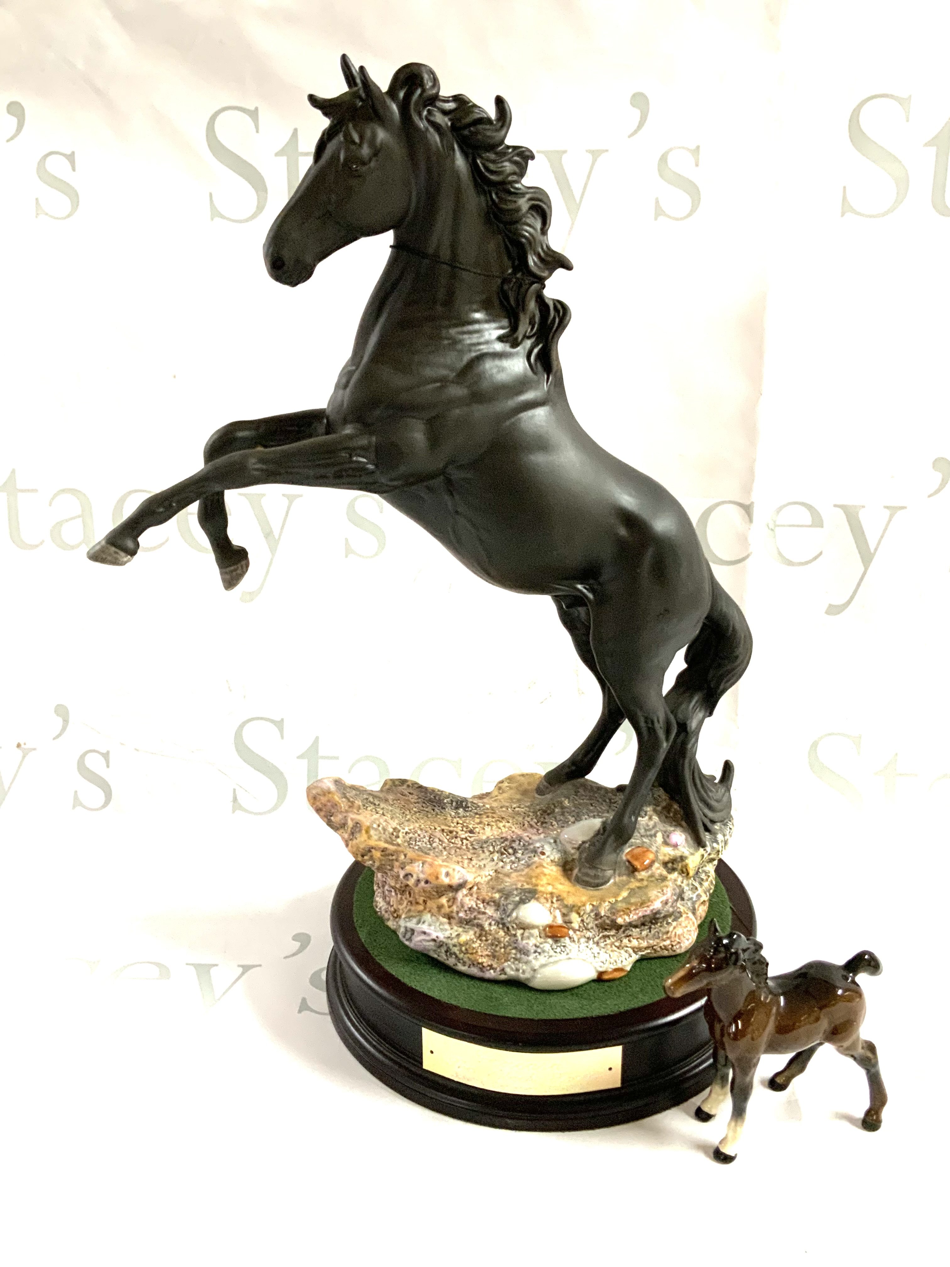 A large Beswick rearing horse named Cancara The Black Horse, Centenary 1894-1994, with base (2 boxes) additional small beswick horse. (D)