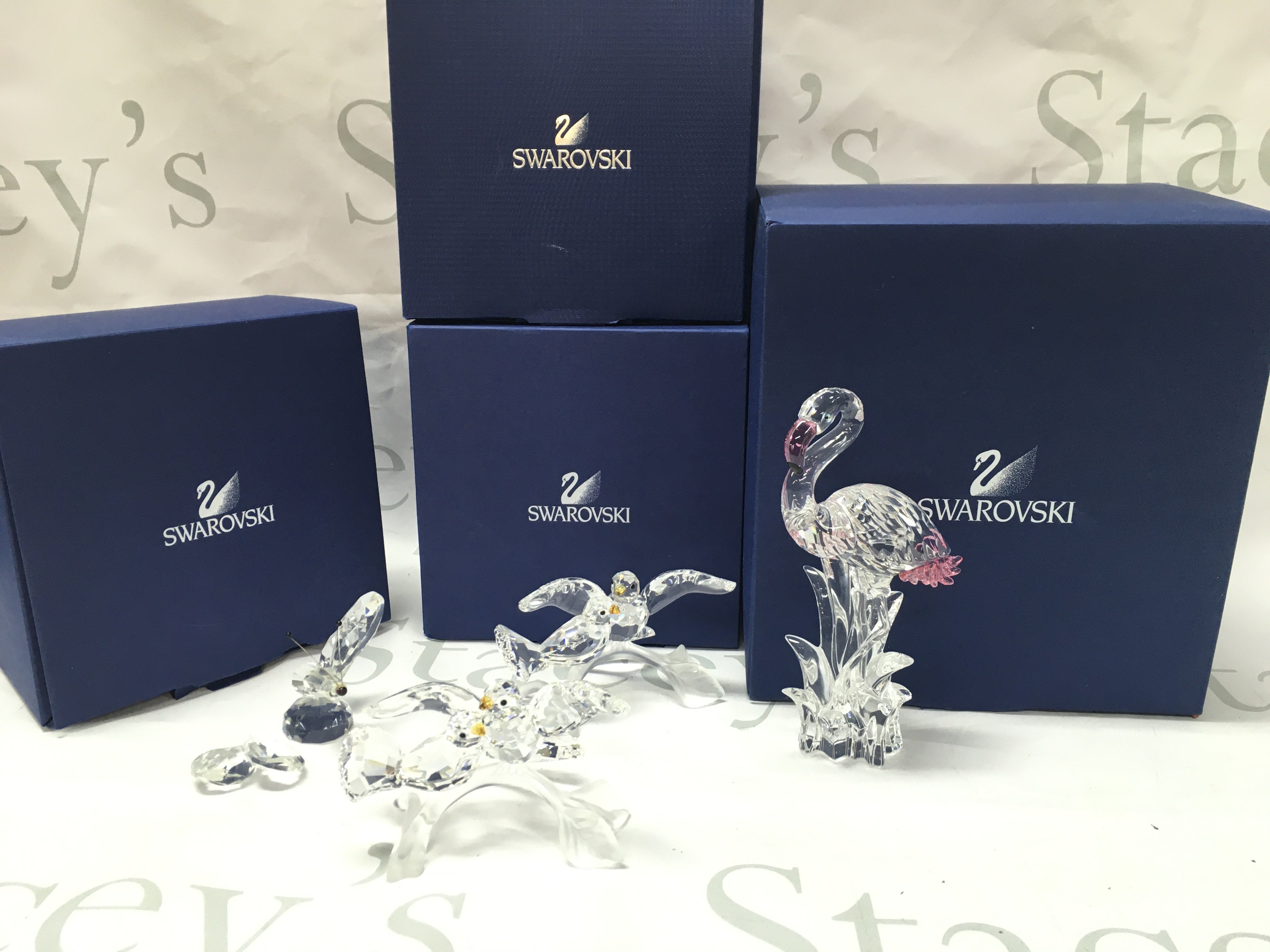 Boxed Swarovski including Flamingo figure, Turtledoves, Damaged butterfly. Postage category C