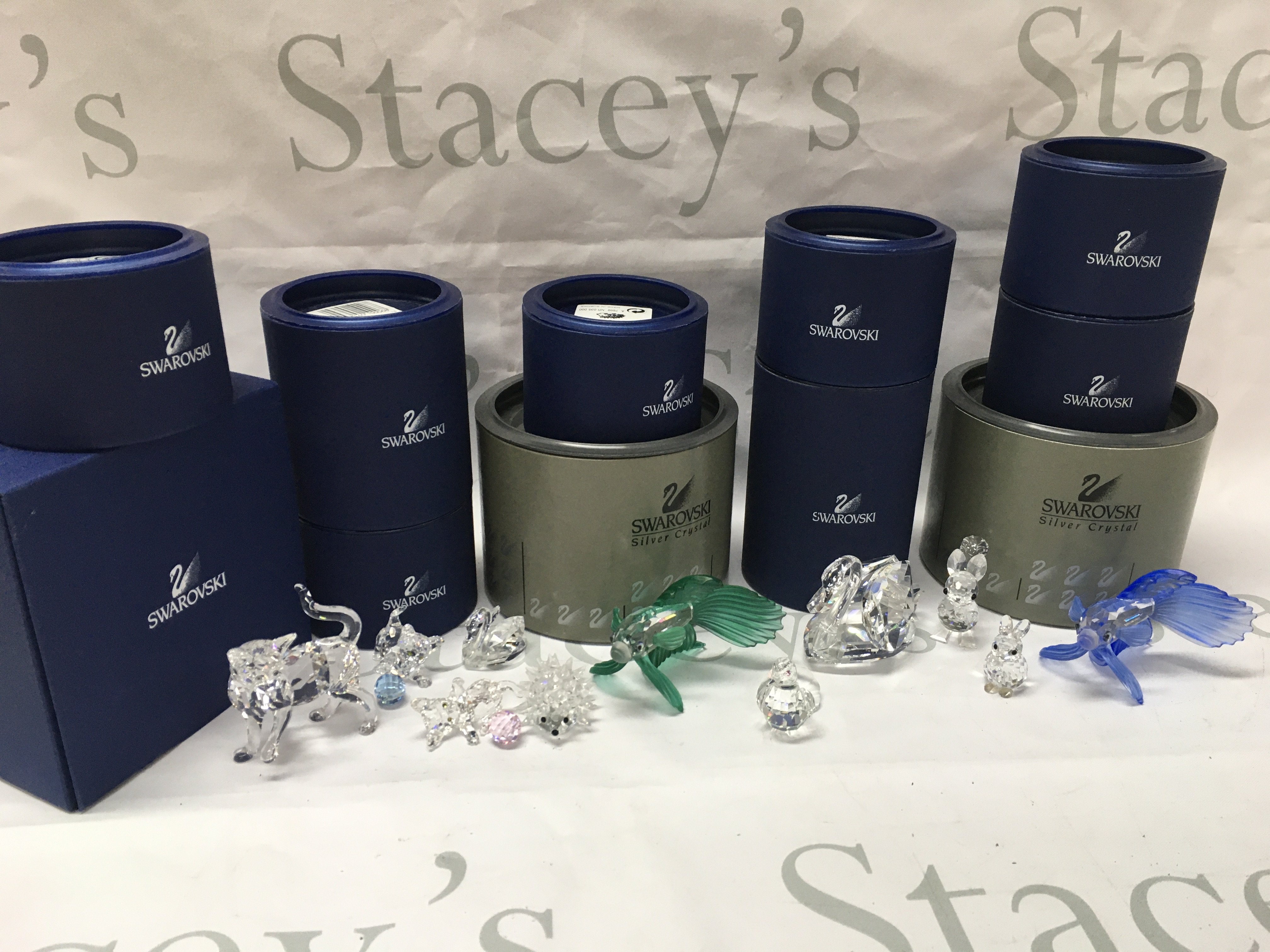 Boxed Swarovski crystal glass figures including cats, fish, swans etc . Postage category C