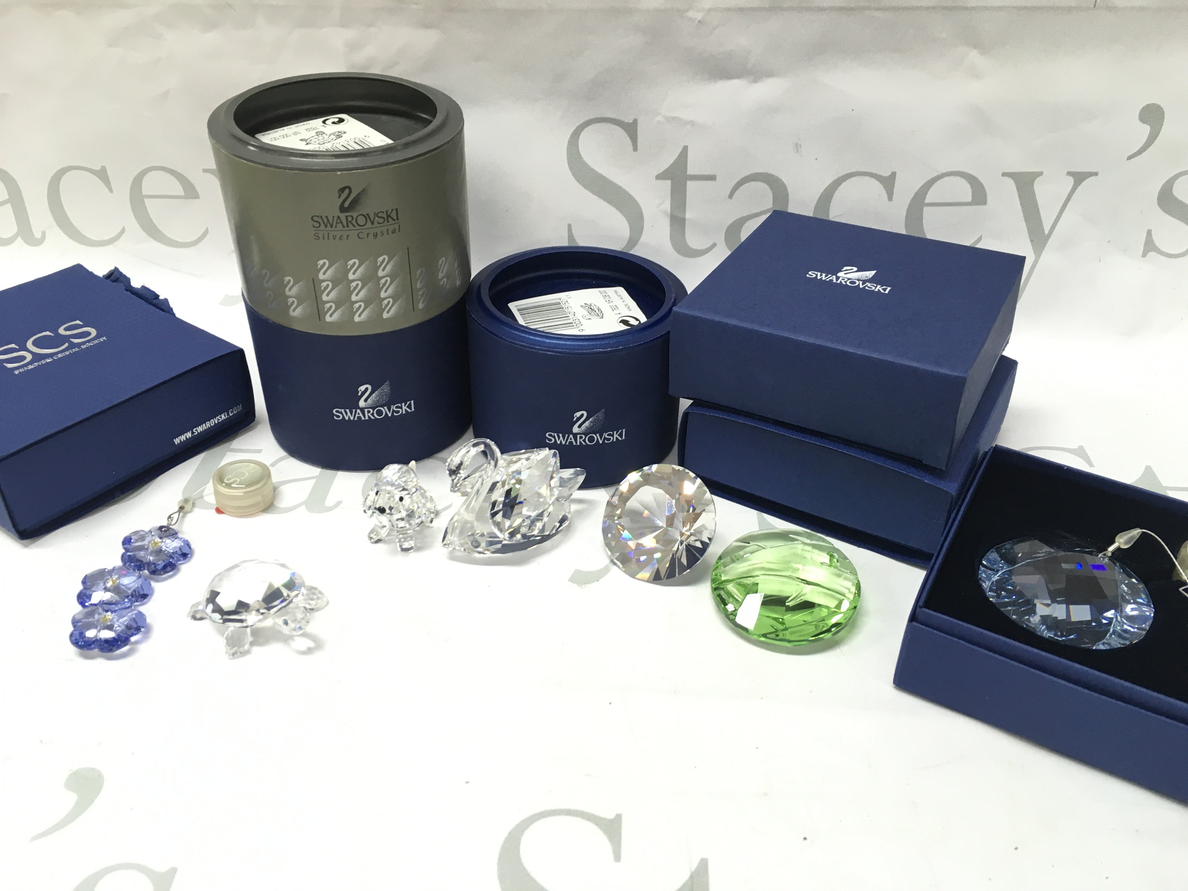 A collection of Swarovski crystal glass figures and ornaments including turtle, swan, dog etc