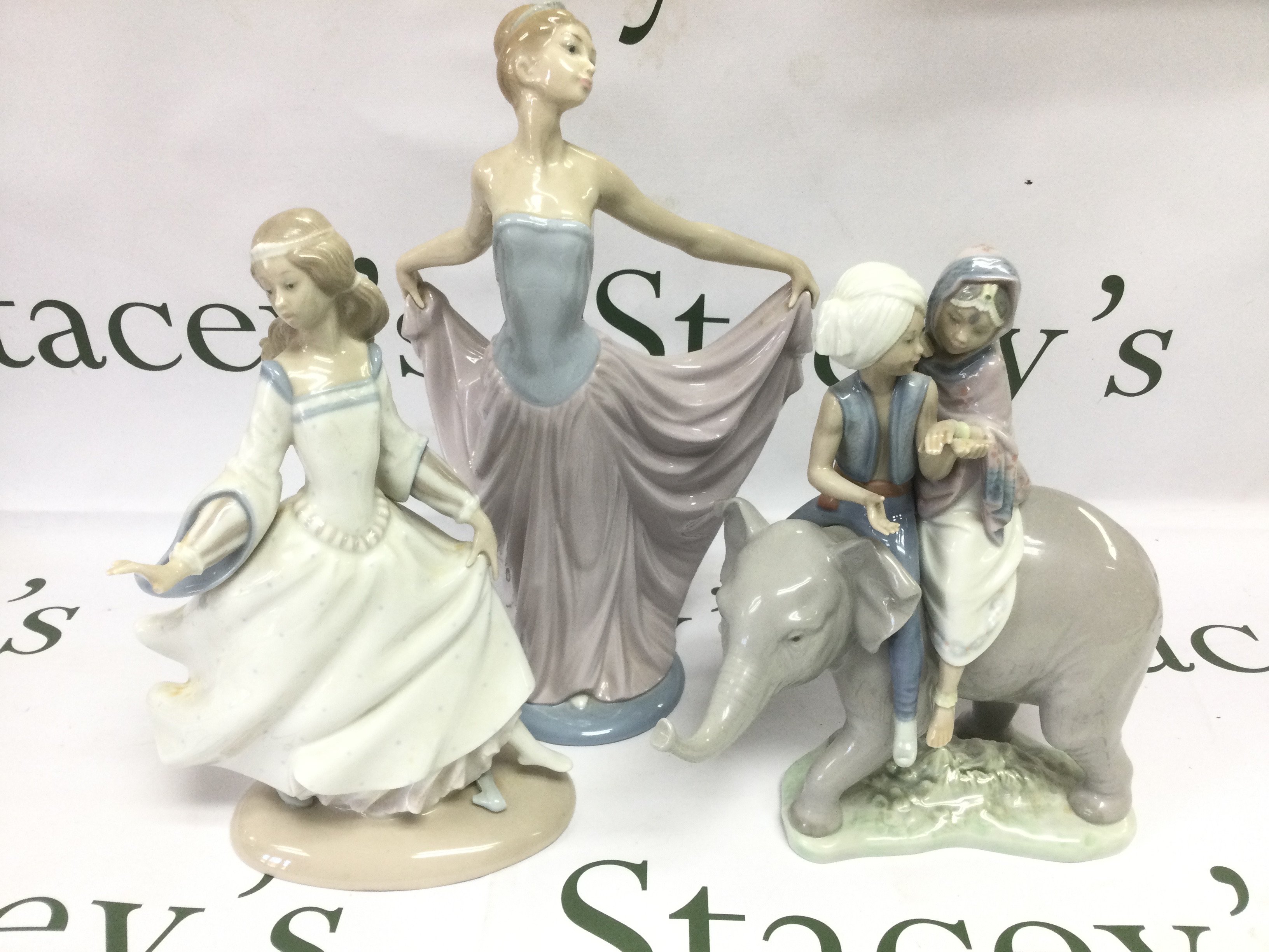 Three Lladro figures including two boxed examples. Shipping category D.
