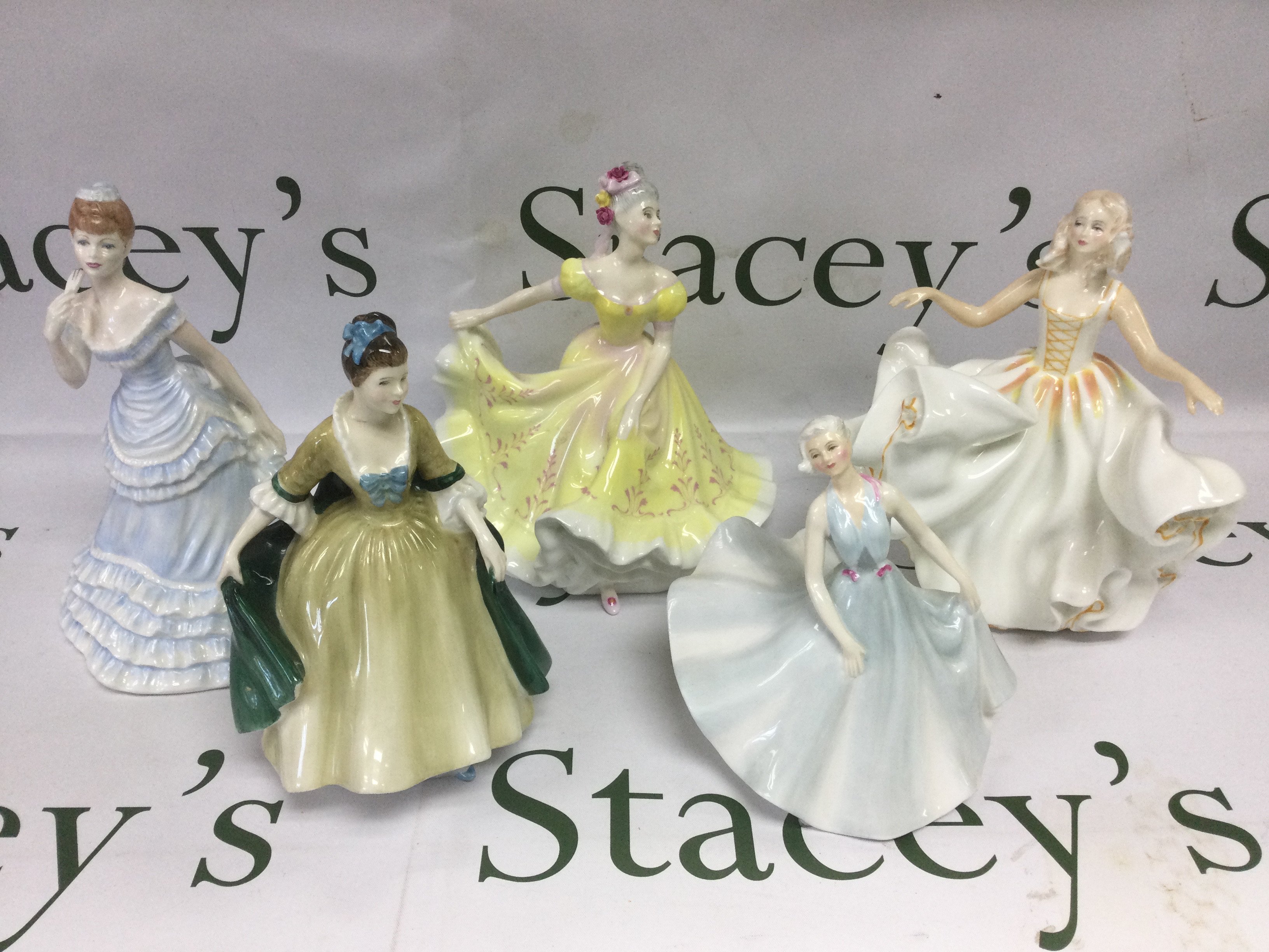 Four Royal Doulton figures of ladies plus one boxed Coalport example (5). Shipping category D.