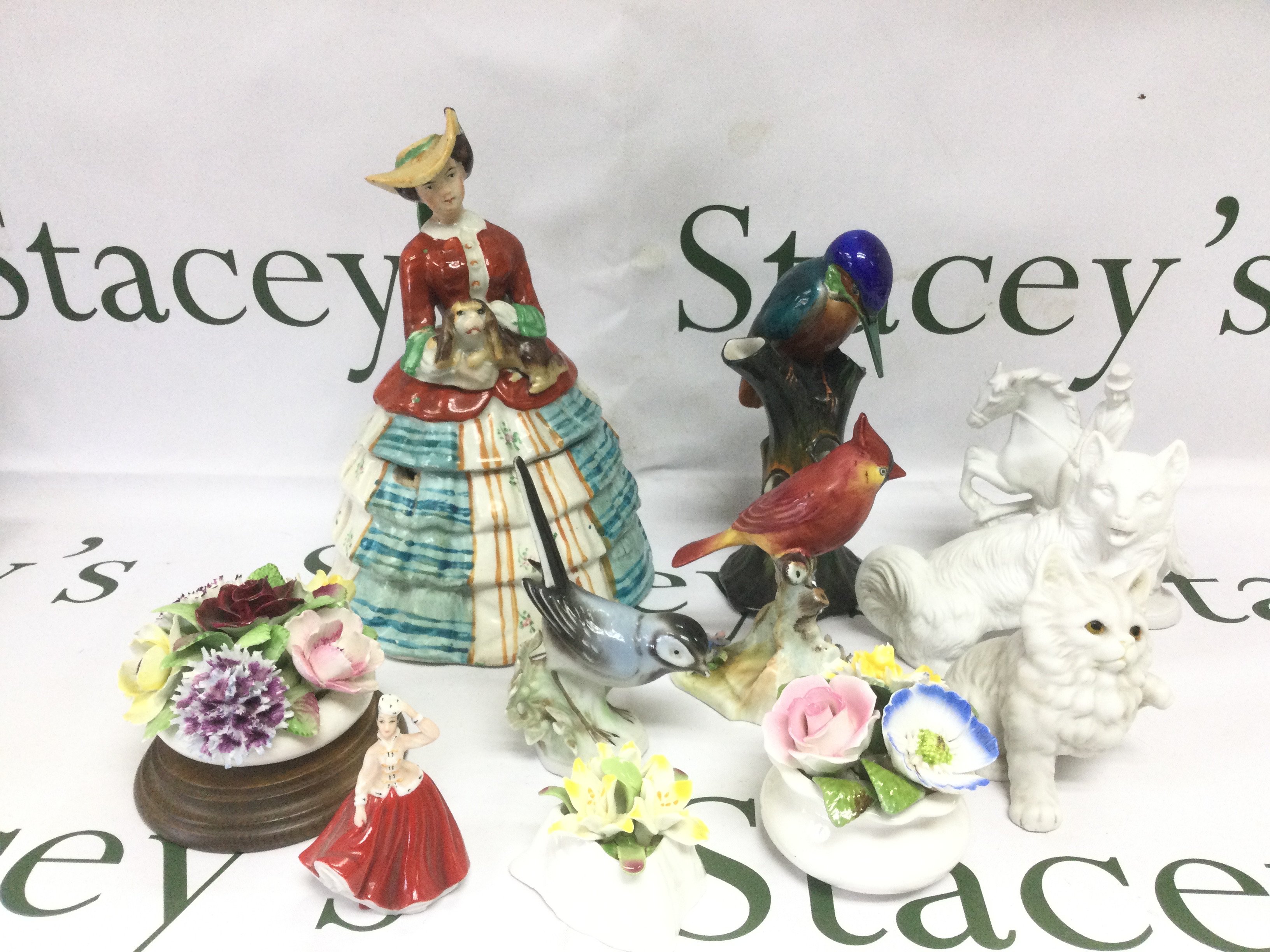 A collection of china items comprising figures of birds, posies etc. Shipping category D.