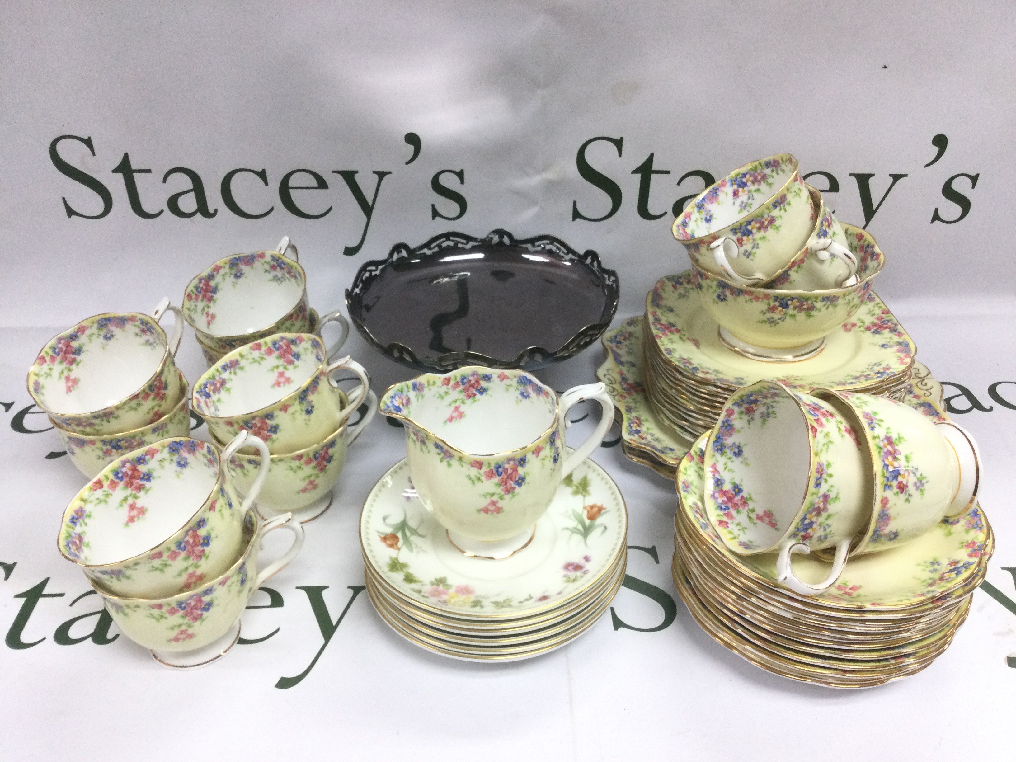 A collection of Royal Albert teaware in Maytime pattern plus some Wedgwood saucers and a silver plated tazza. Shipping category D.