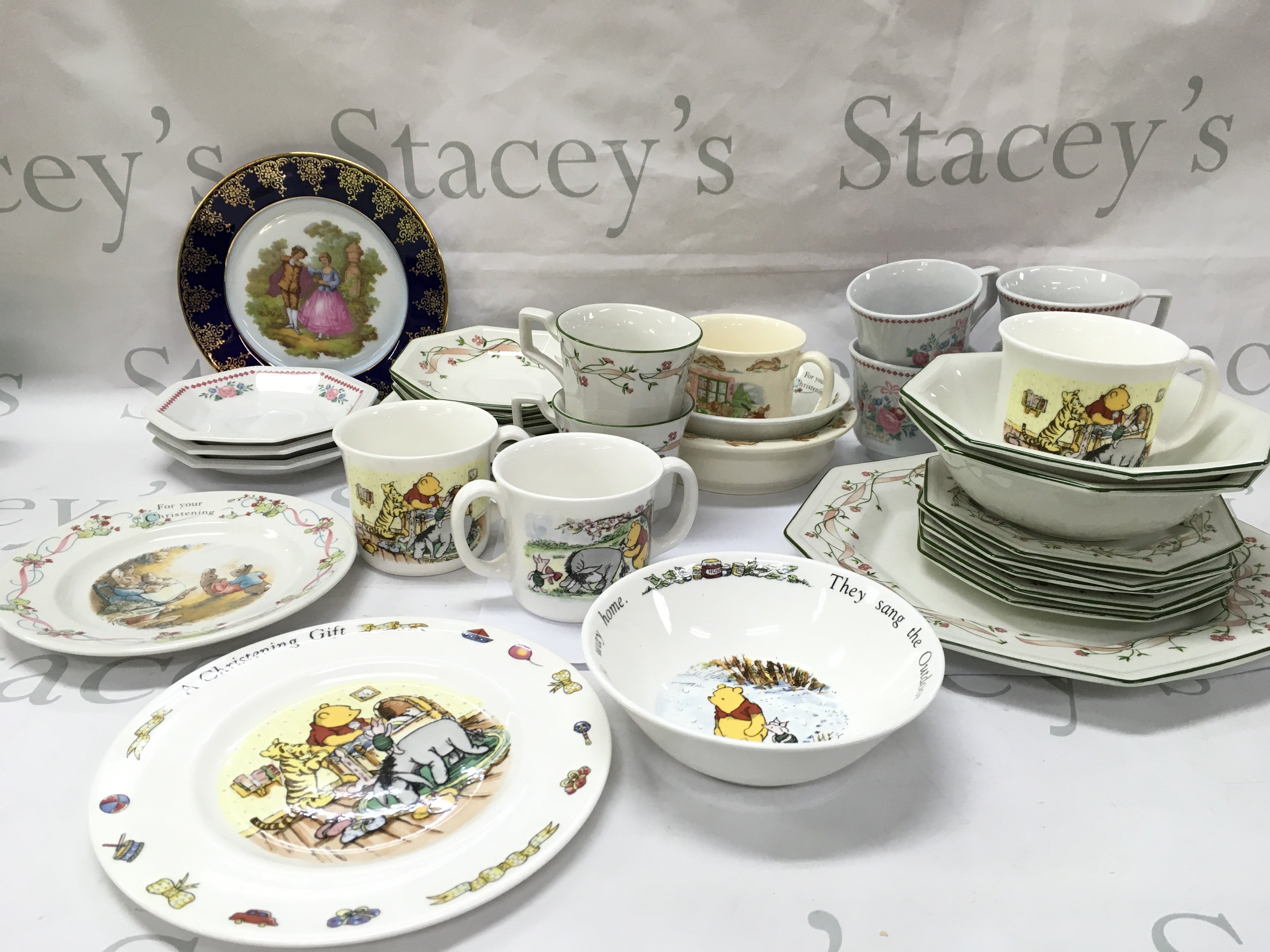 Royal Doulton Disney Winnie the Pooh and Bunnykins christening sets including plate, mugs, bowl etc. also including a Limoges plate and another tea set. This lot cannot be posted