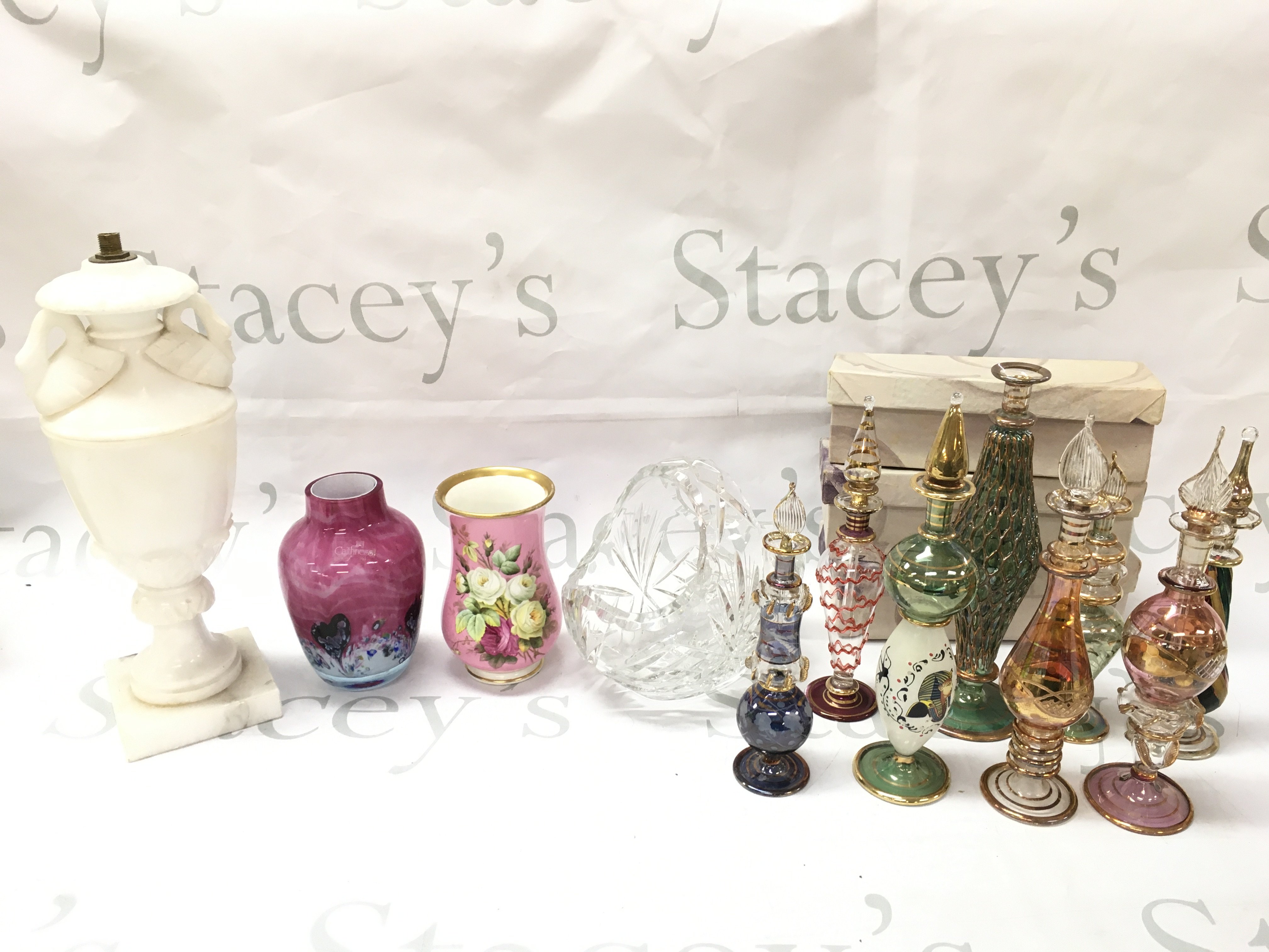 A collection of ceramics including a Caithness vase , Alabaster swan lamp, pink vase with hand painted rose design, cut glass basket, egyptian perfume decanters (3 boxed). This lot cannot be posted