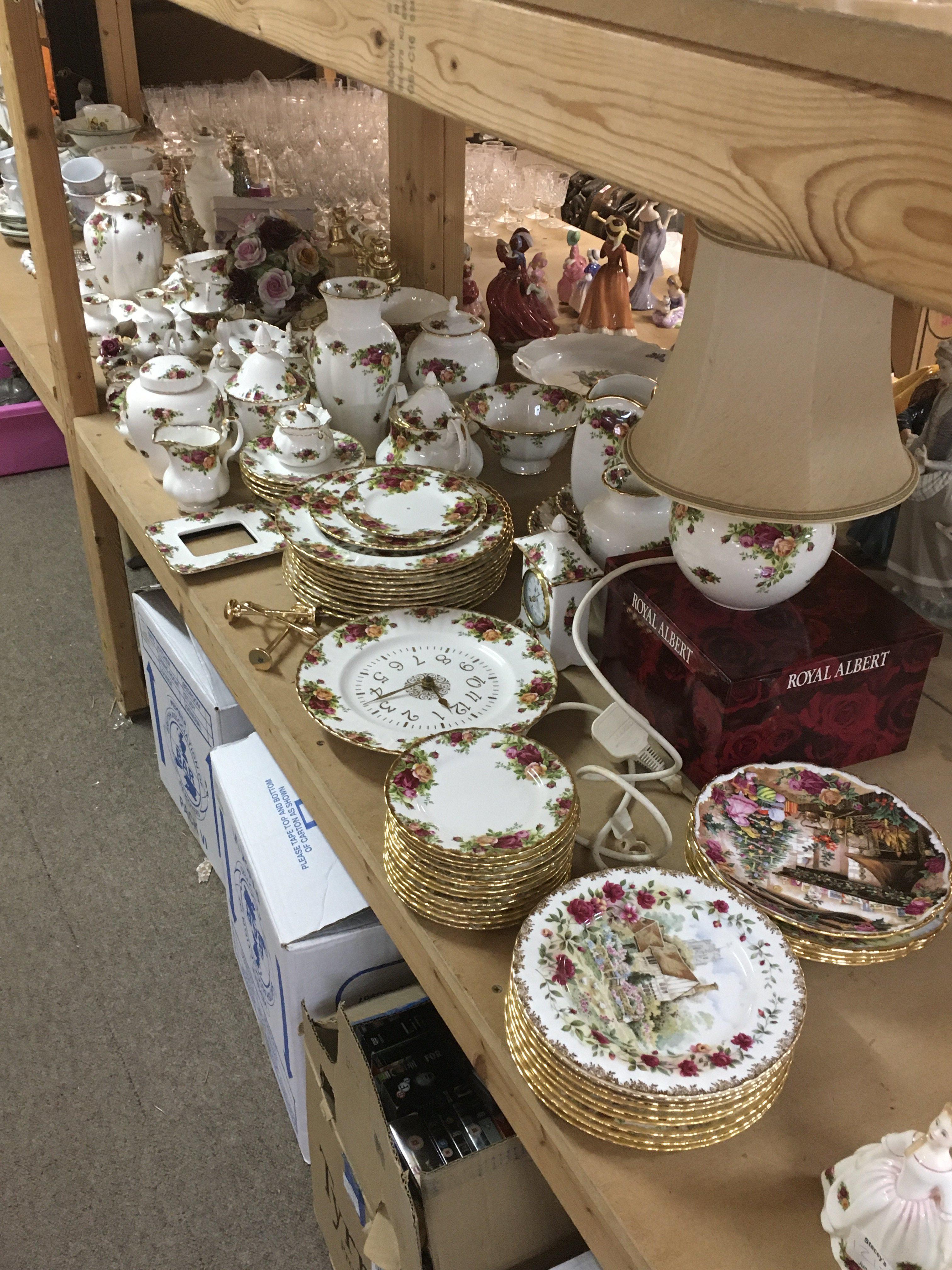 A collection of Royal Albert Country Rose including cups, saucers, plates, vases, telephone, clock etc. this lot cannot be posted