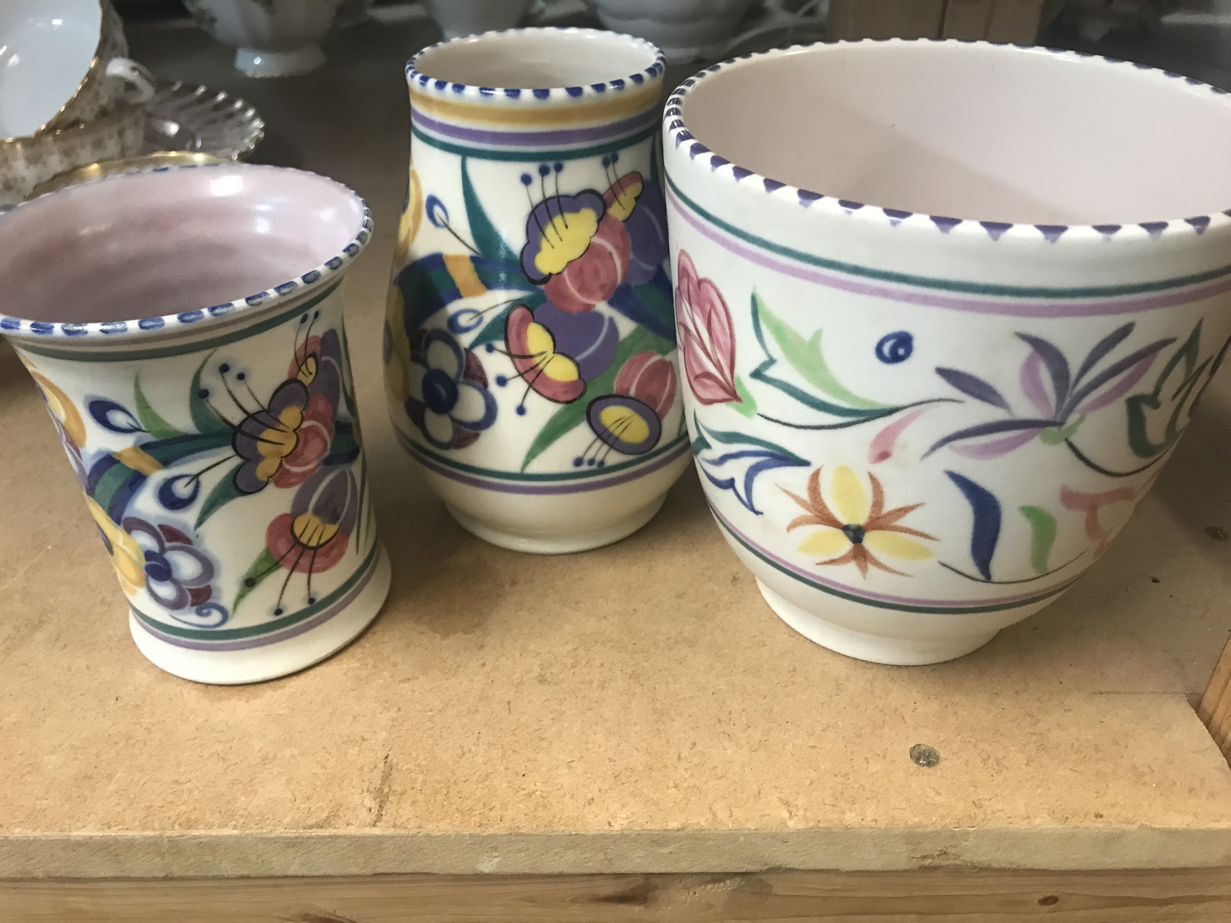 Three items of Poole pottery together with a ceramic vase lustre bowl and two glass vases .