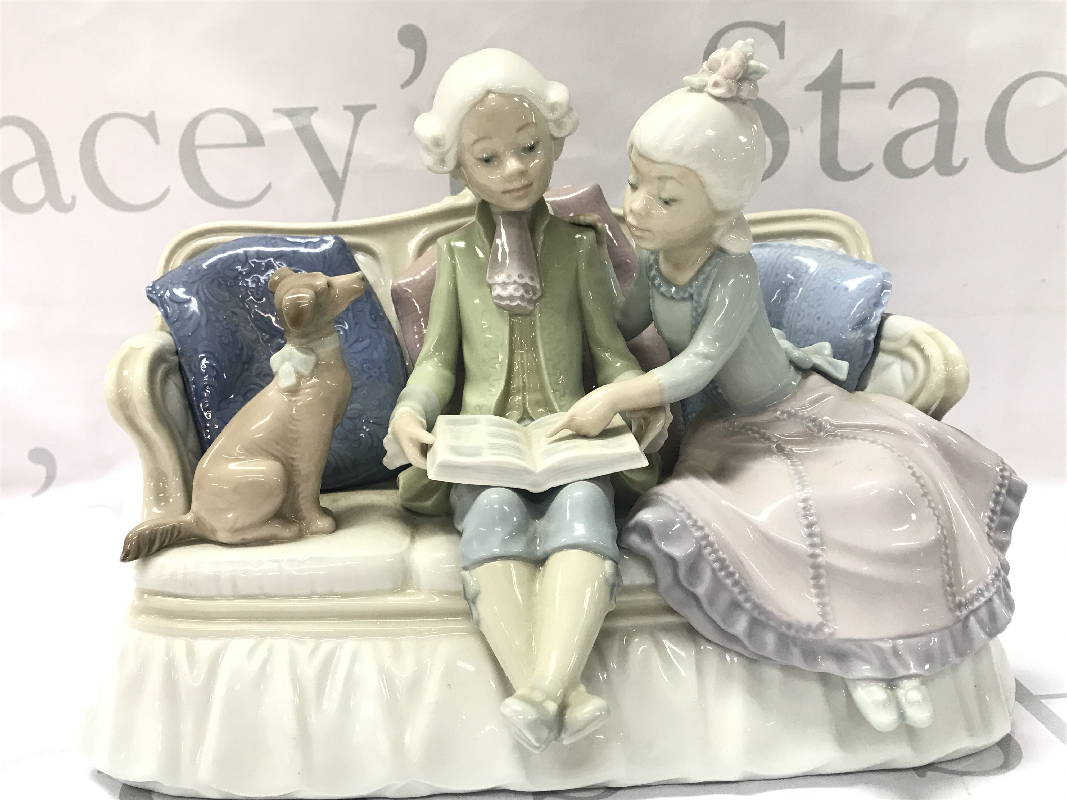 Lladro Storytime porcelain figure group. 19cm tall .This lot cannot be posted