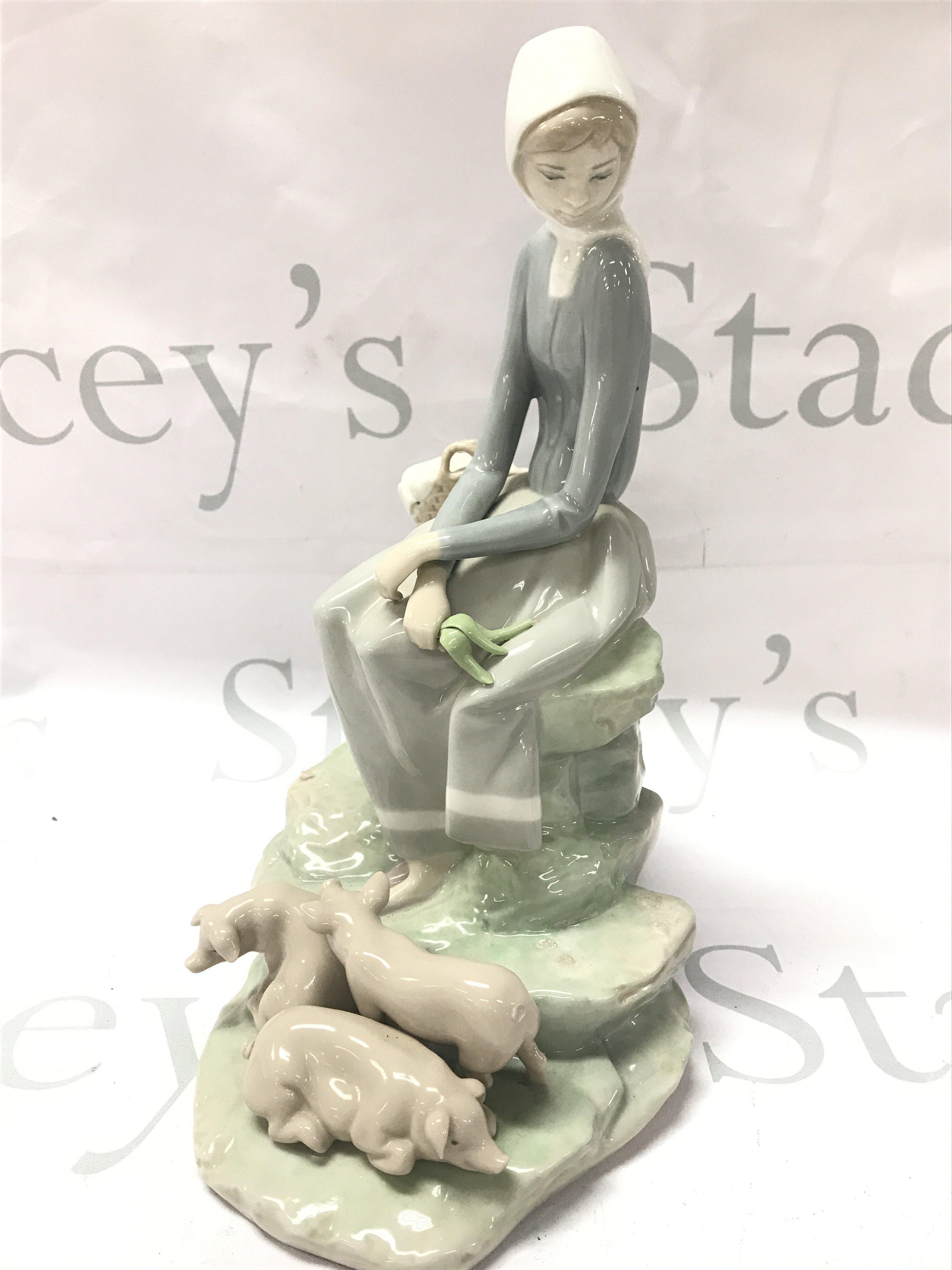 Lladro porcelain figure , girl with geese. This lot cannot be posted