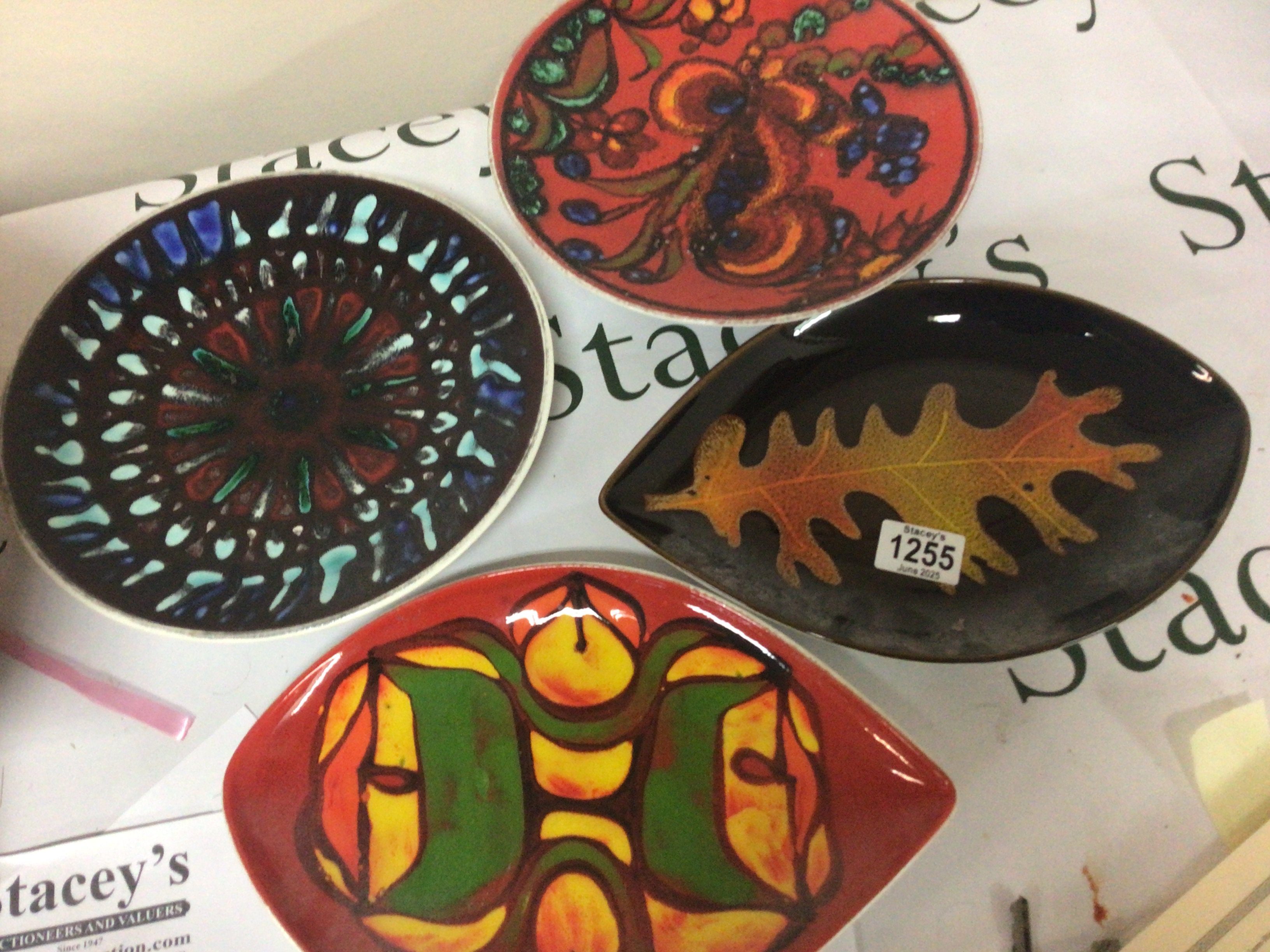 A collection of mid 20th century Poole pottery designer dishes one cracked. (4) No Reserve.