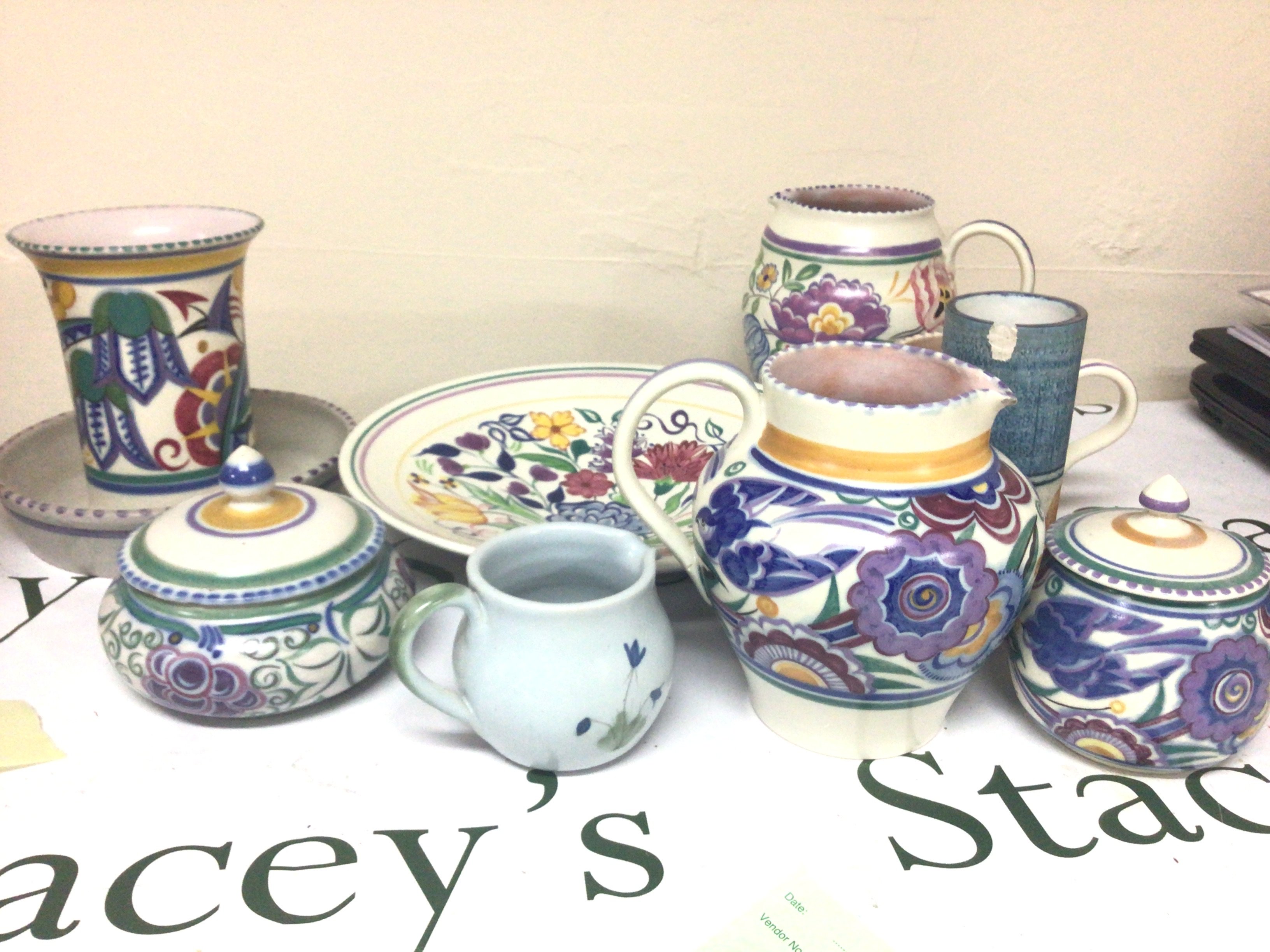 A collection of Poole pottery jugs vases and a dish and a Troika vase (damaged)
