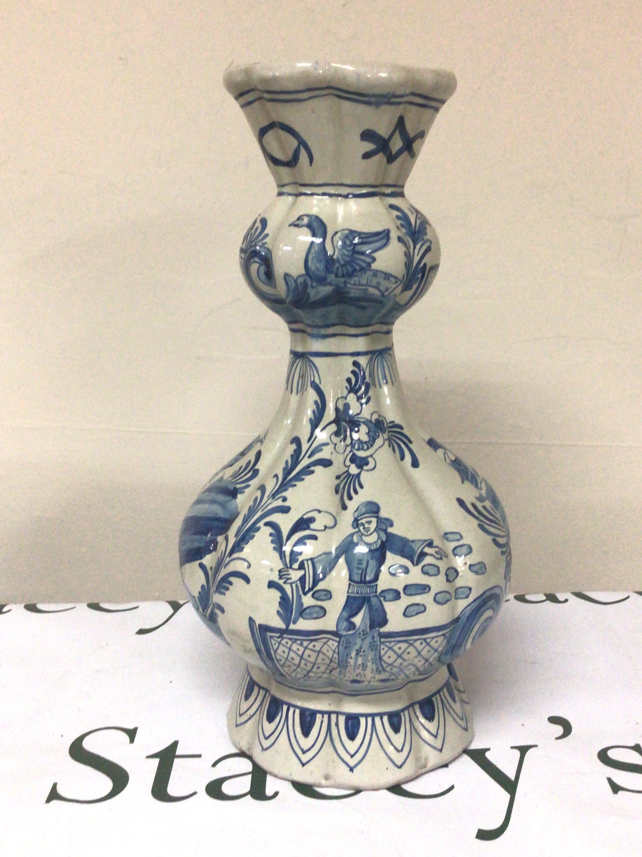 A 19th century Dutch Delft blue and white vase decorated with figures birds and foliage signed base height 33cm