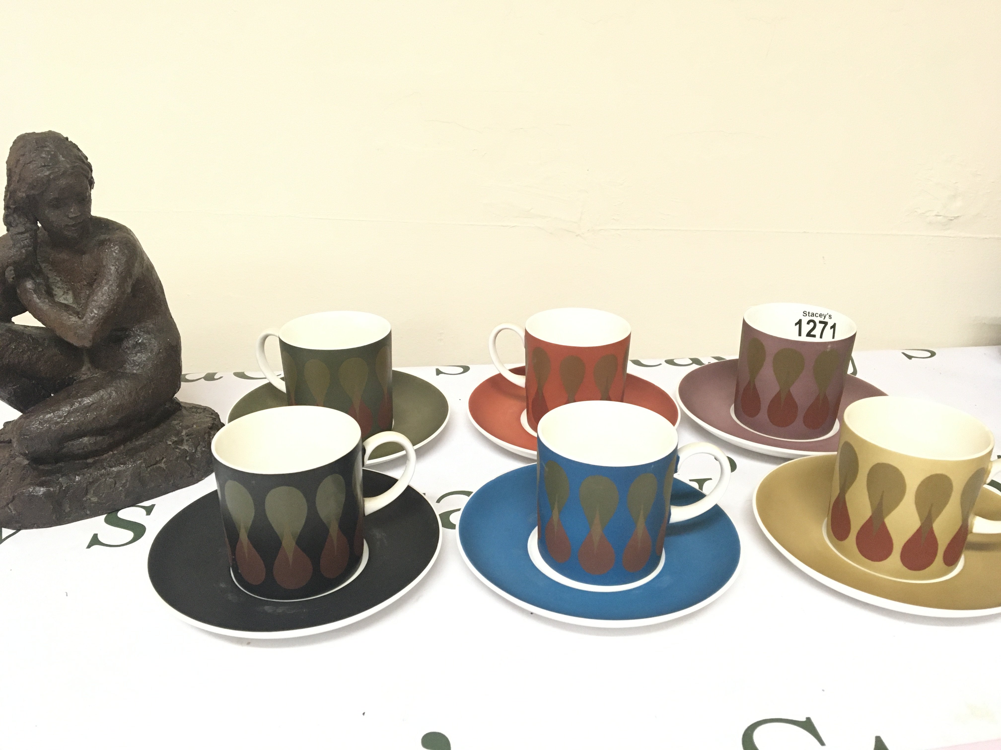 A Modern design Wedgwood Coffee service Susie Cooper Design multi coloured set and simulated bronze sculpture.