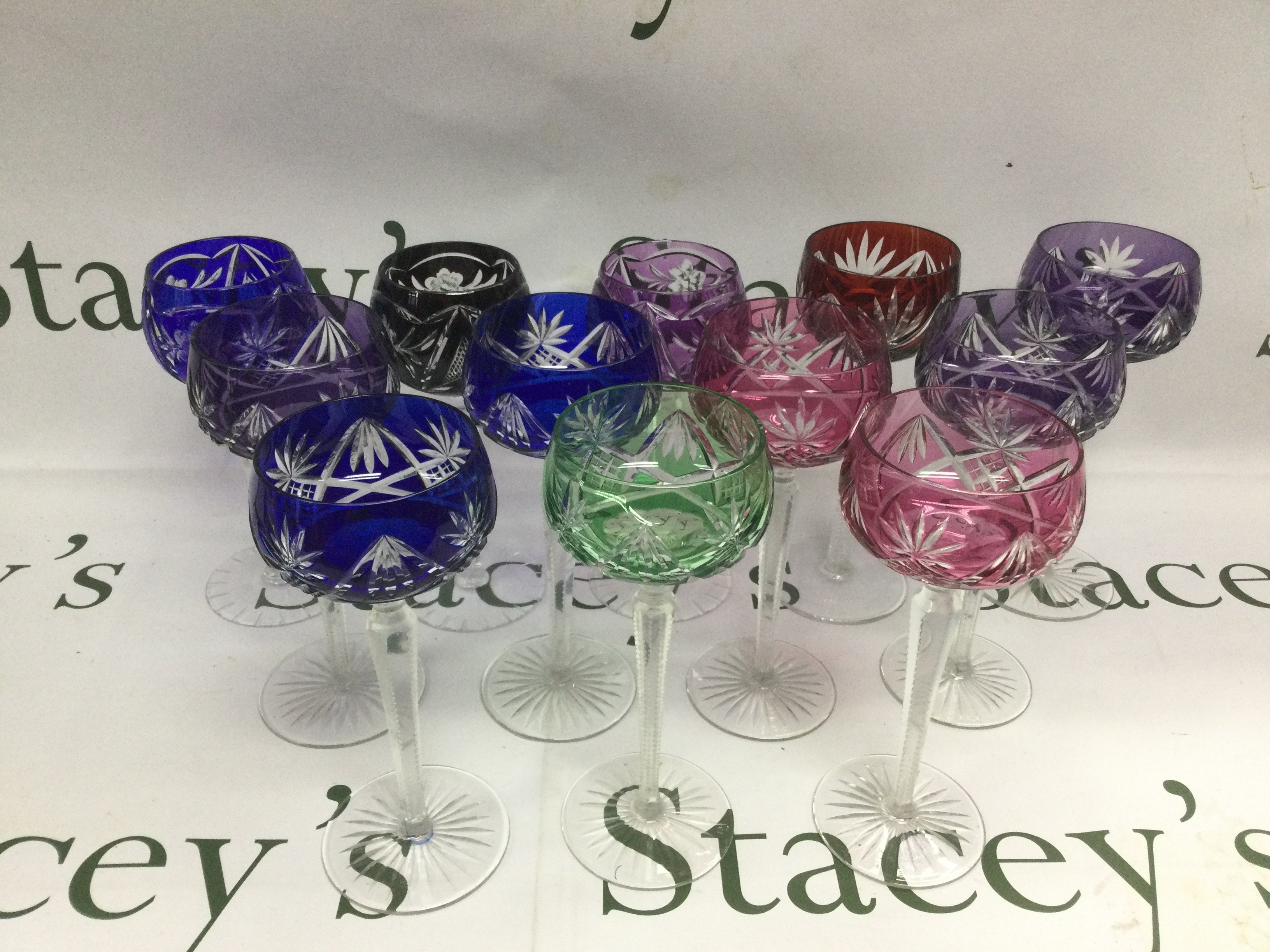 Nine Bohemian cut crystal hock glasses and three others. Shipping category D.