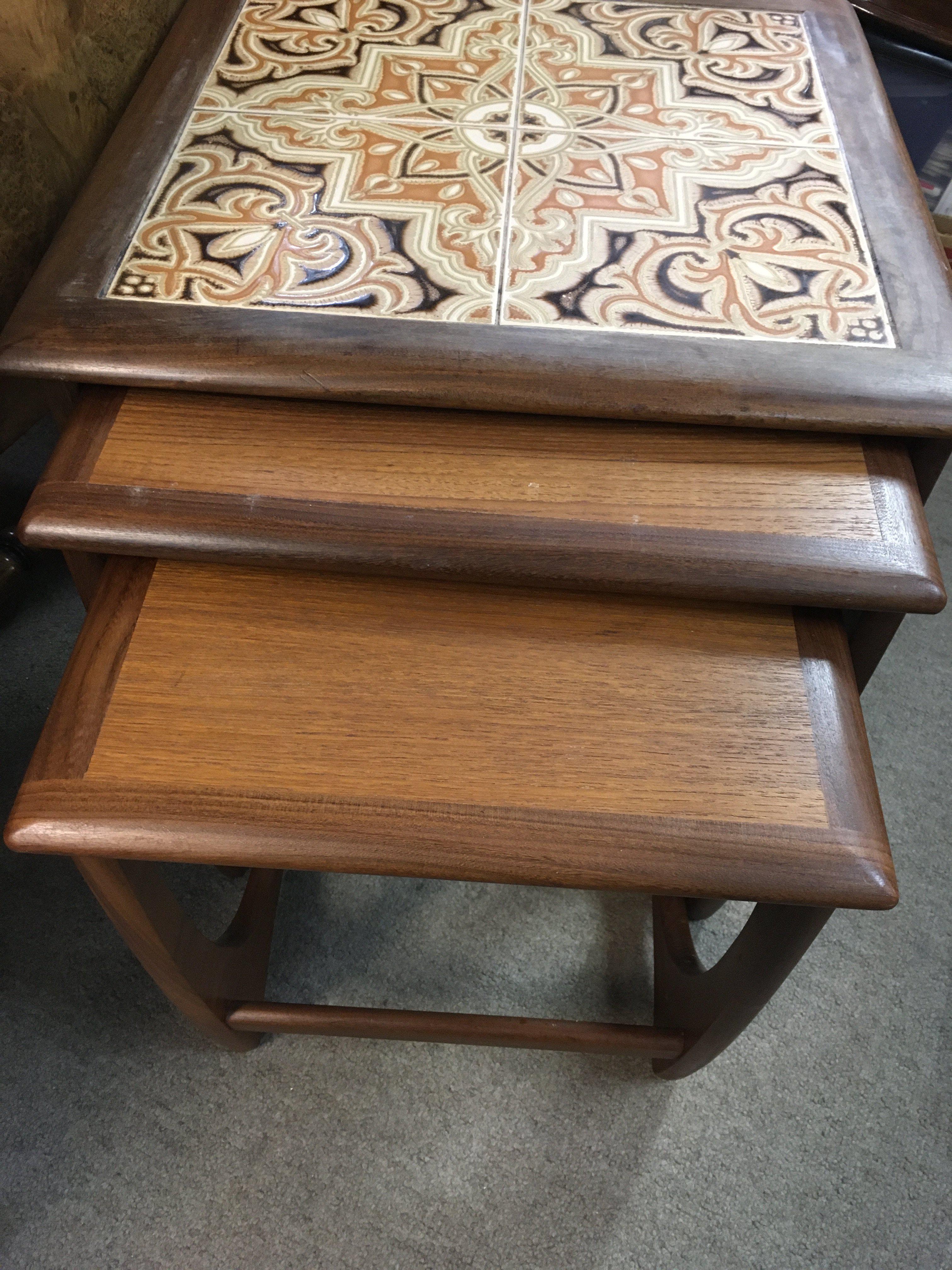 A nest G plane tables one inset with tiles.