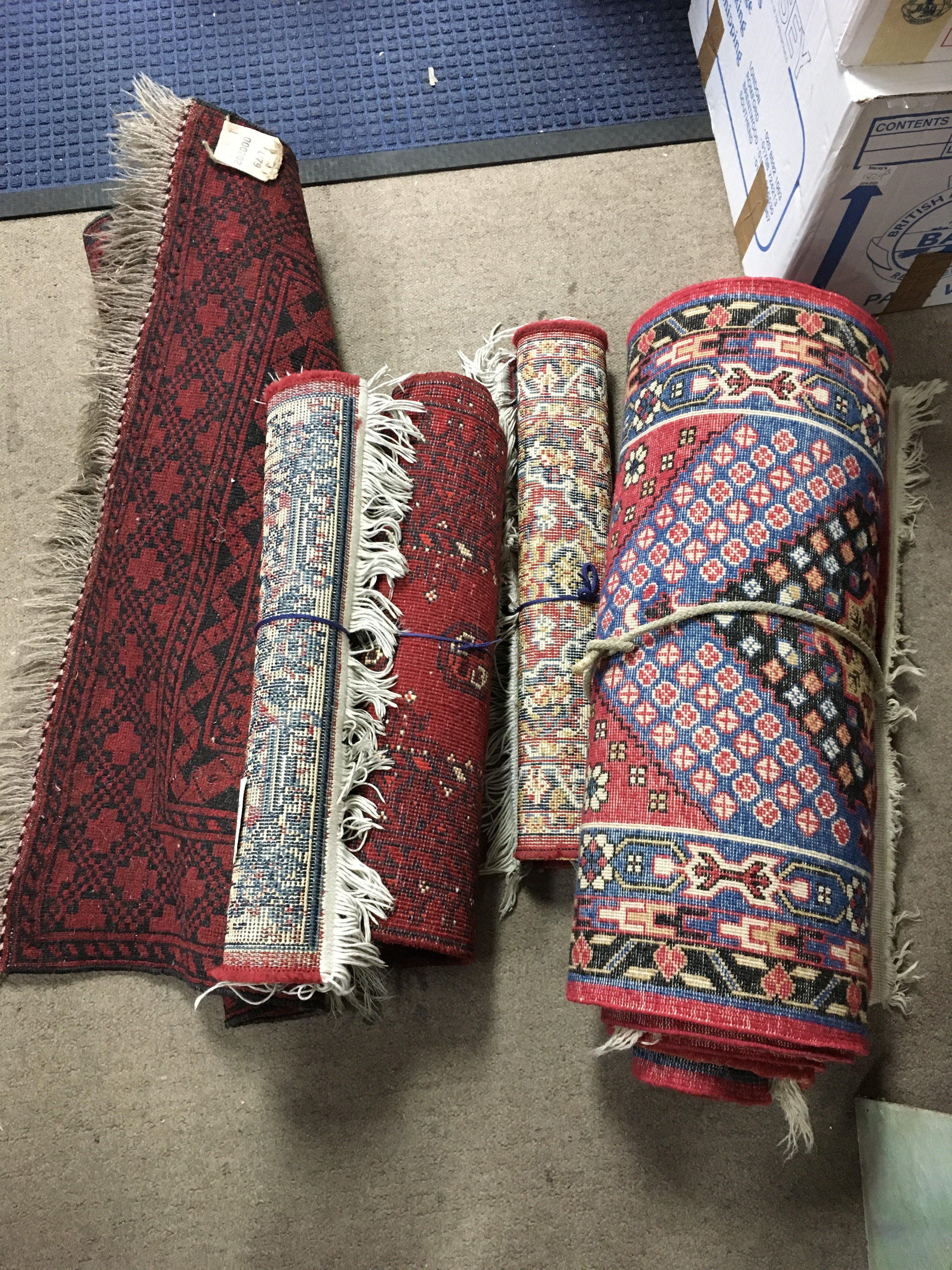 Two small carpets and three rugs.