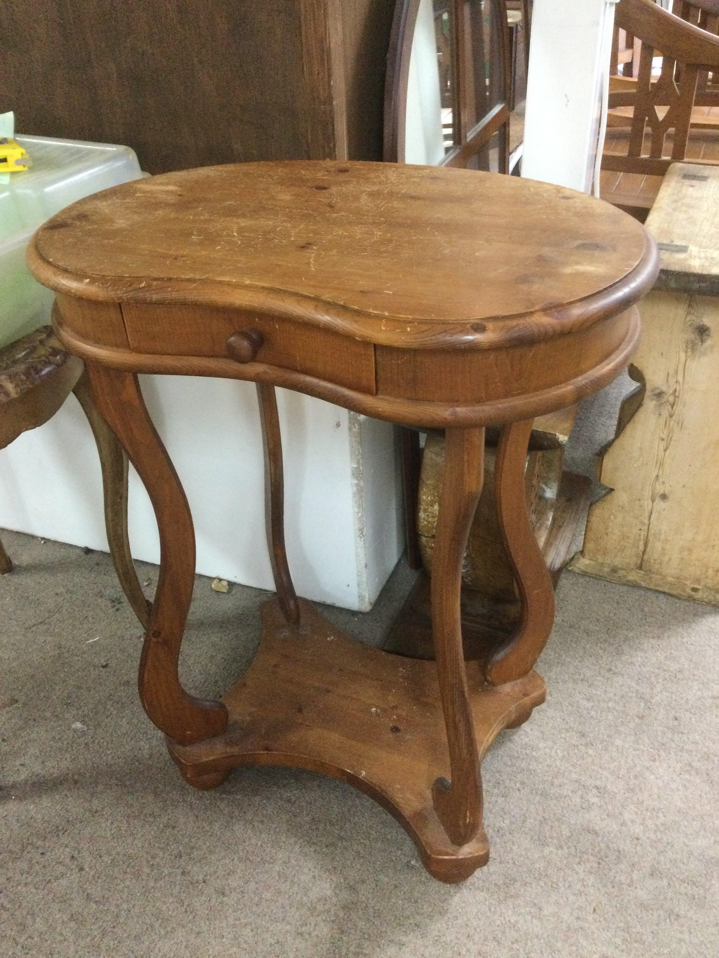 A kidney shaped pine side table fitted with a single drawer, approx height 69.5cm. Shipping category D.