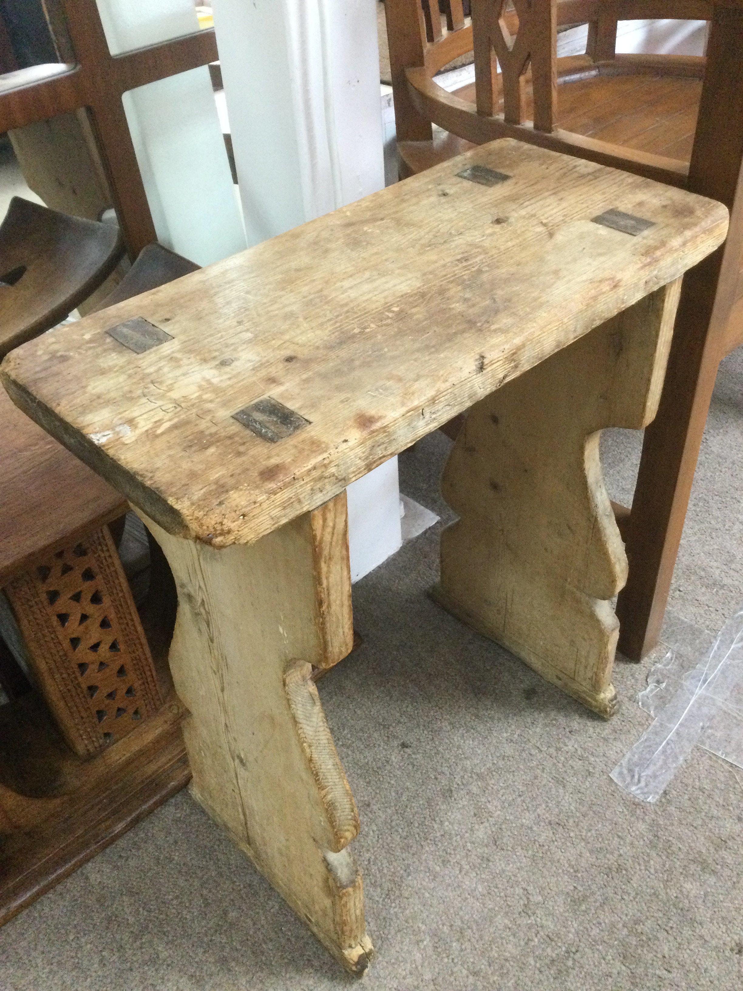 A rustic pine stool, approx height 55cm. Shipping category D.