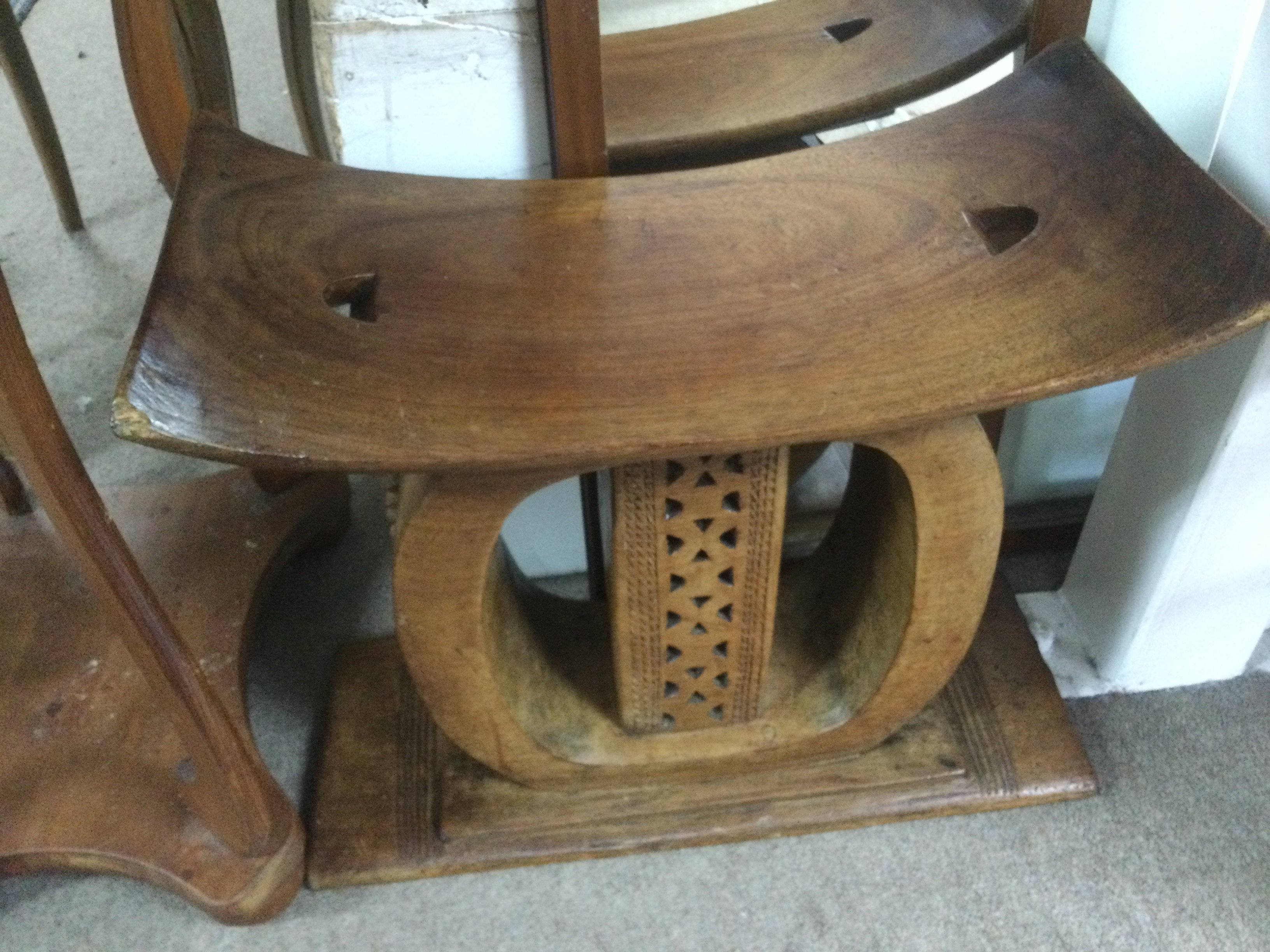 A hardwood carved ethnic stool, approx height 45cm. Shipping category D.