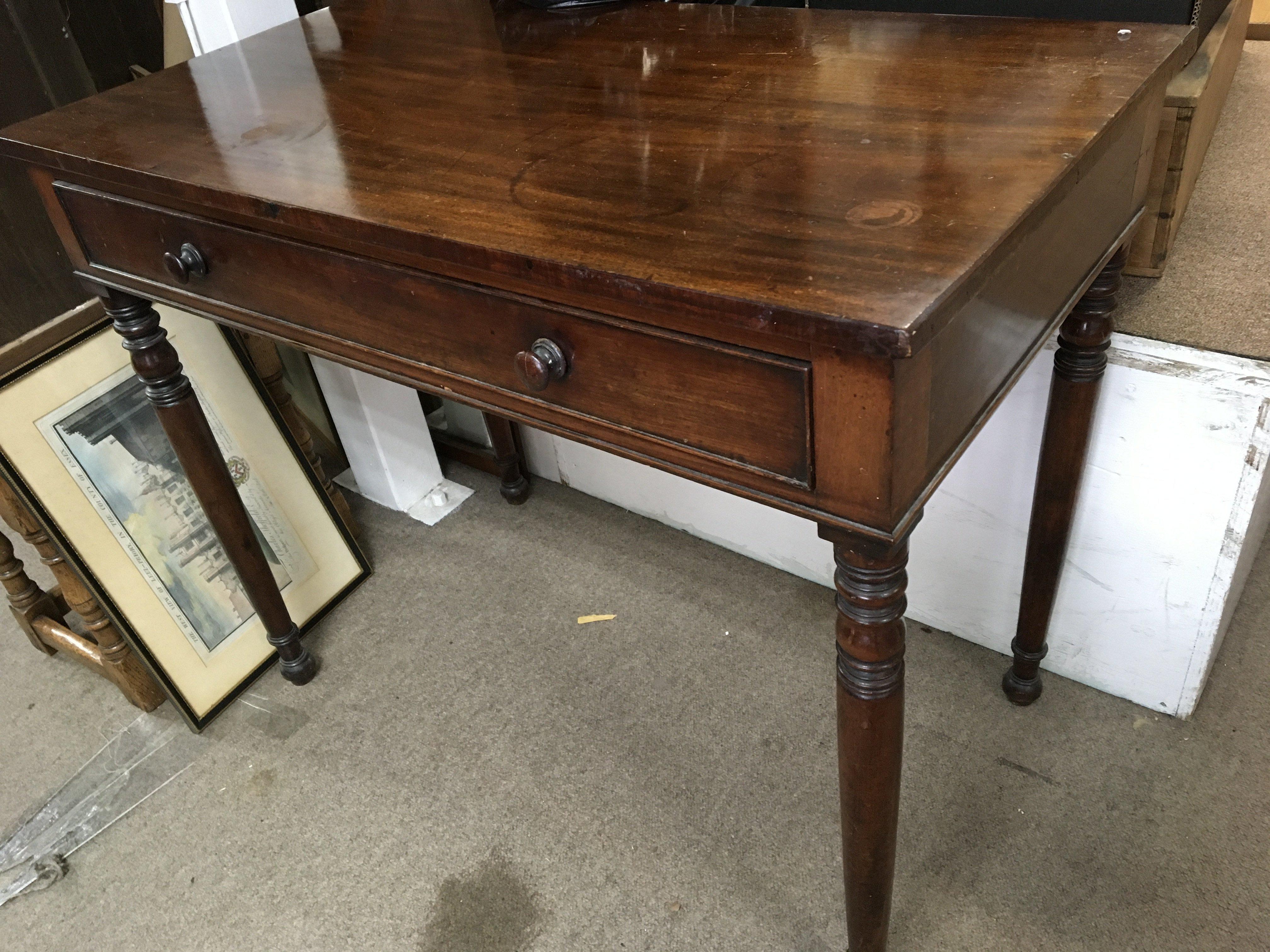 An Early Victorian Mahogany side table the rectangular top above a single drawer on turned legs. NO RESERVE