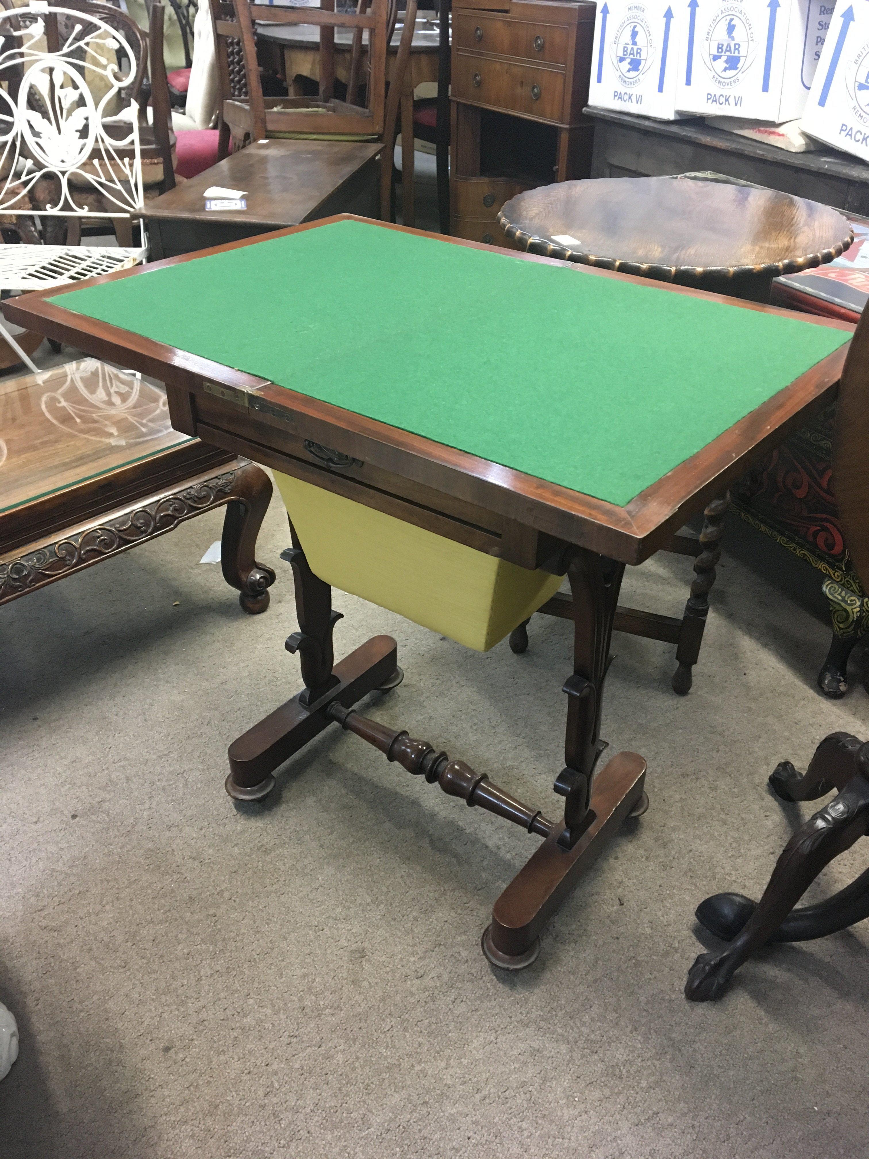 A Victorian mahogany work box games table the hinged top with a green above a single drawer on shaped supports. NO RESERVE