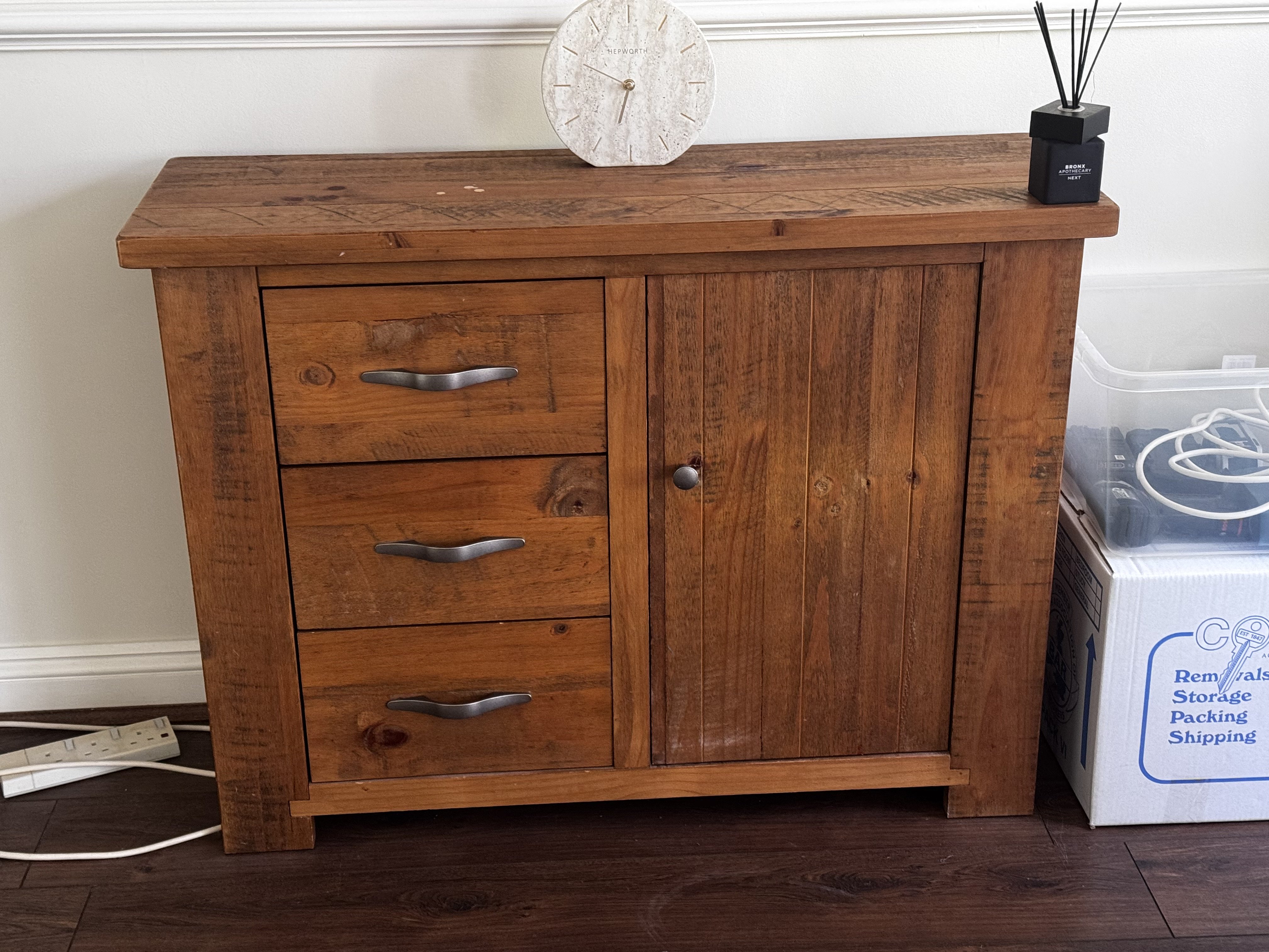 A Modern pitch pine sideboard, cabinet. 98cm x 80cm x 35cm together with a matching wall mirror. 110cm x 70cm.
