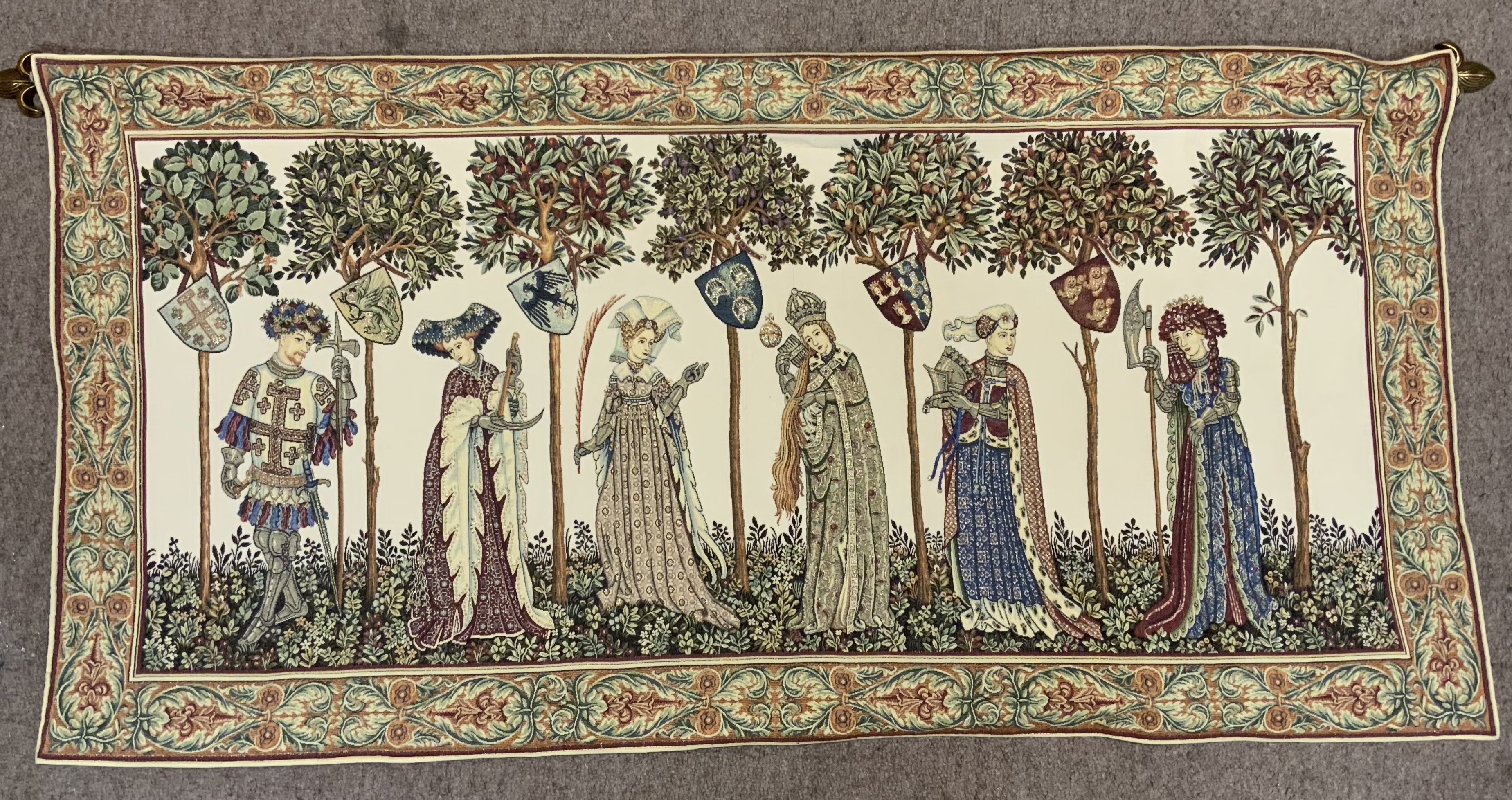 A 20th Century wall tapestry depicting a medieval scene. 128cm x 63cm