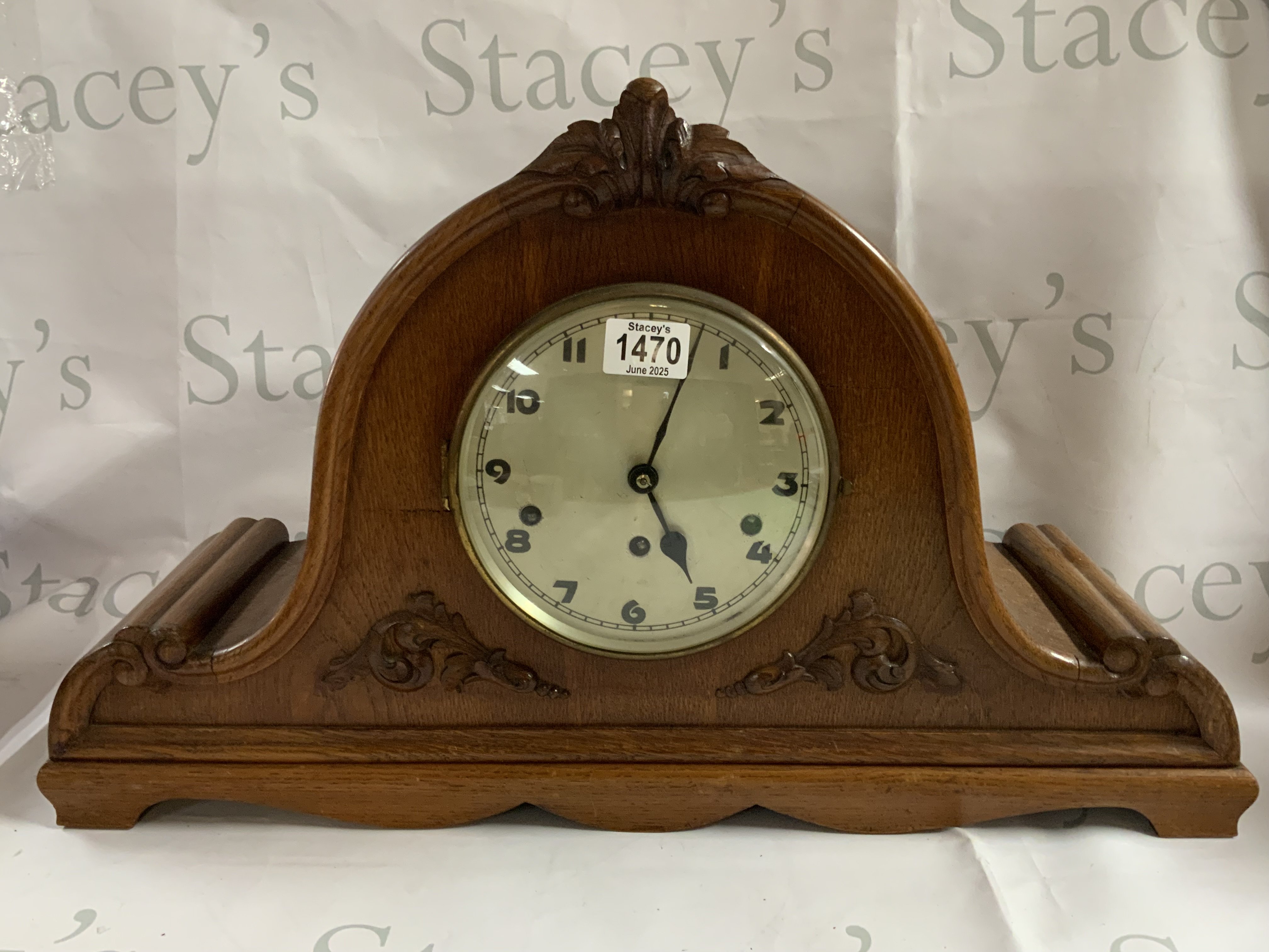 A large oak mantle with Westminster chime. 62cm x 38cm.