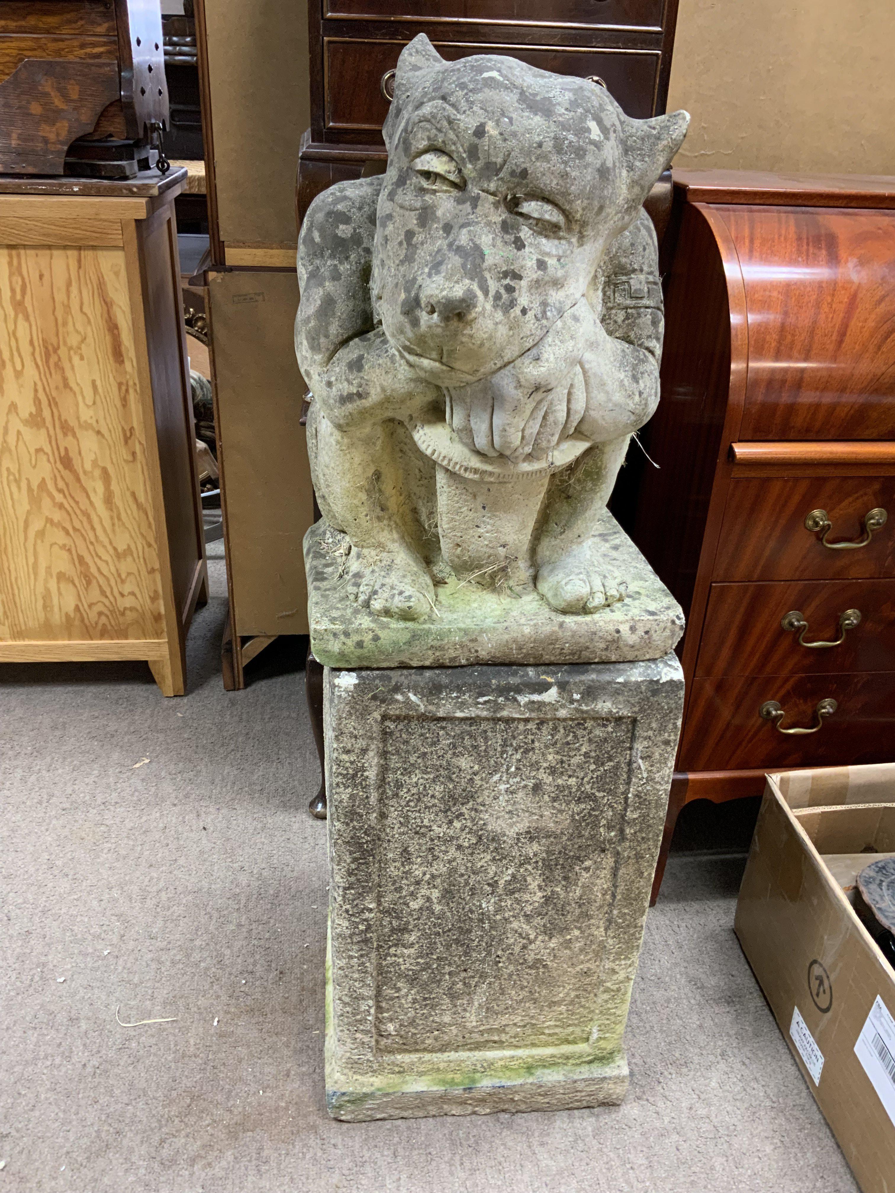 A large cast concrete gargoyle and pedastal. (D)