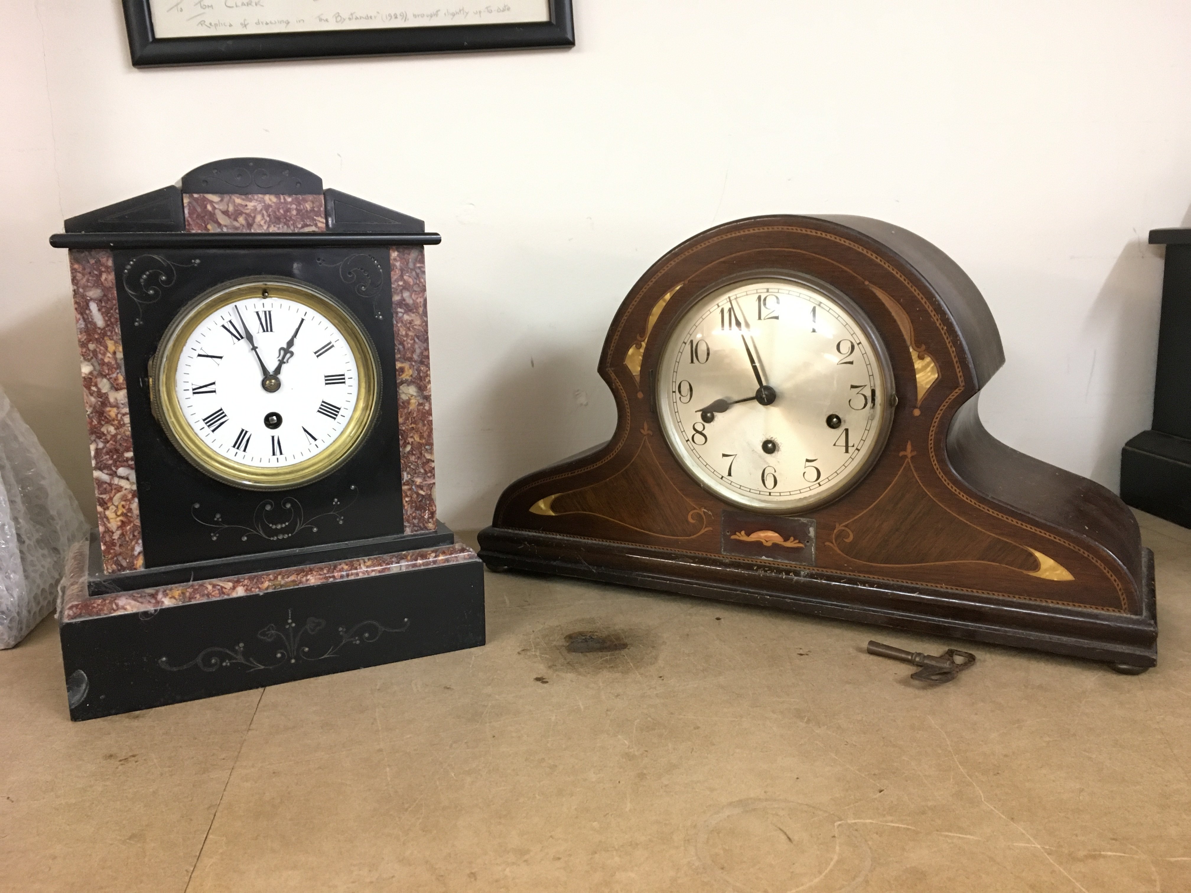 Two mantle clocks- mahogany inlaid clock with German movement (26cm tall 45cm wide) and a slate and marble clock (29cm tall 23cm wide). This lot cannot be posted